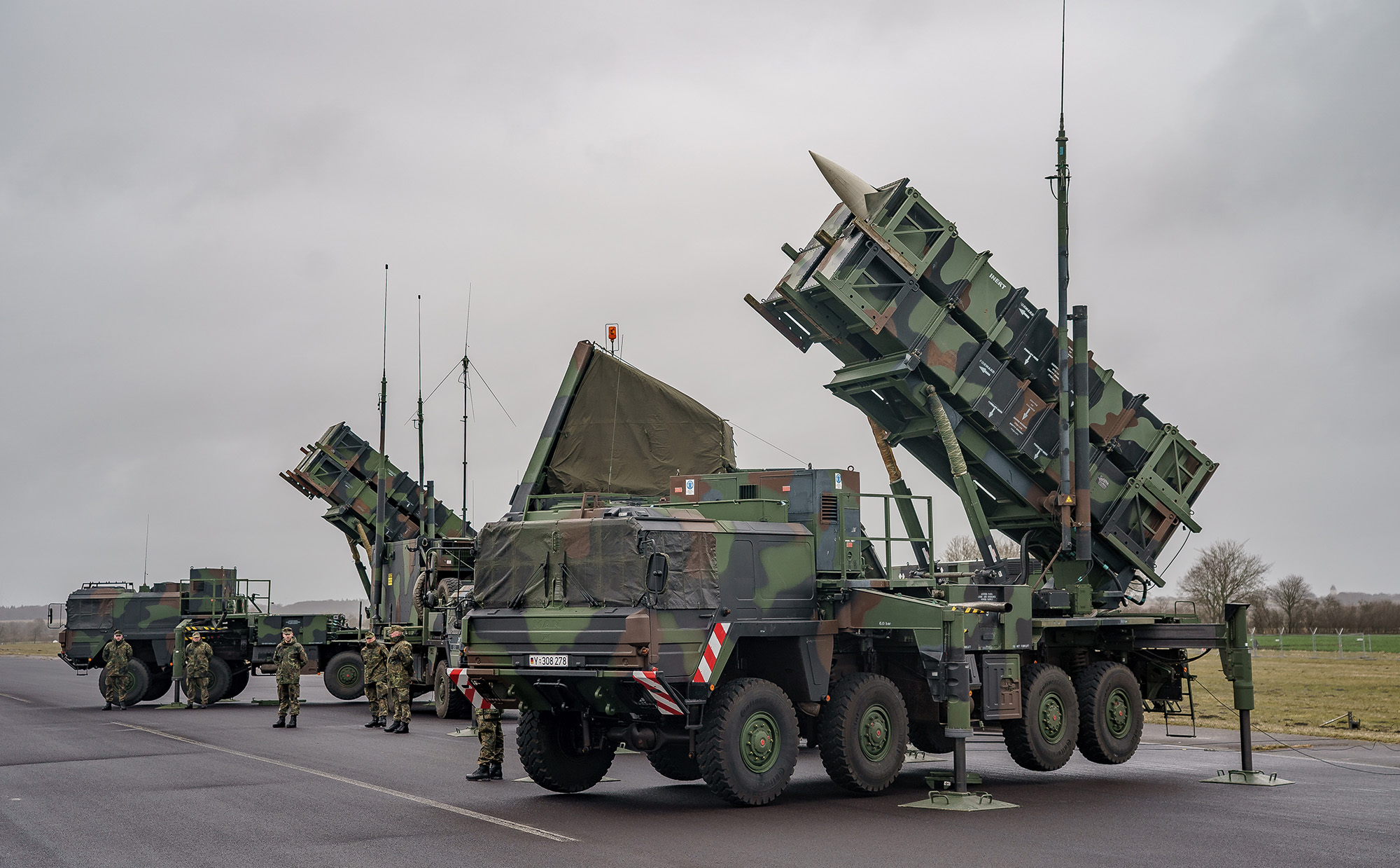 Patriot anti-aircraft missile systems of the 1st anti-aircraft missile squadron of the Bundeswehr stand at the airfield of the Schwesing military airport, Germany, on March 17.
