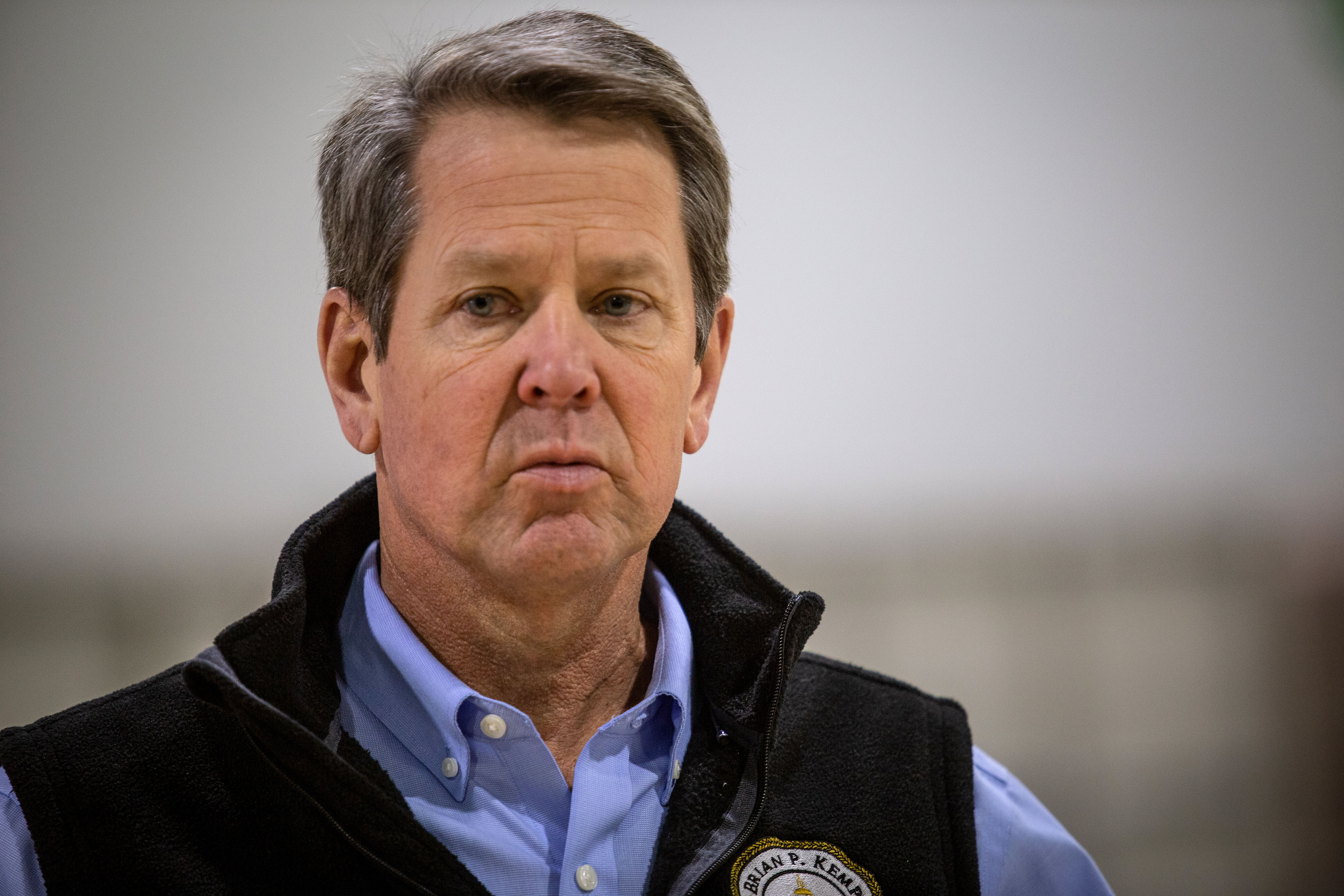 Georgia Gov. Brian Kemp listens to a question from the press during a tour of a temporary hospital at the Georgia World Congress Center in Atlanta on April 16.