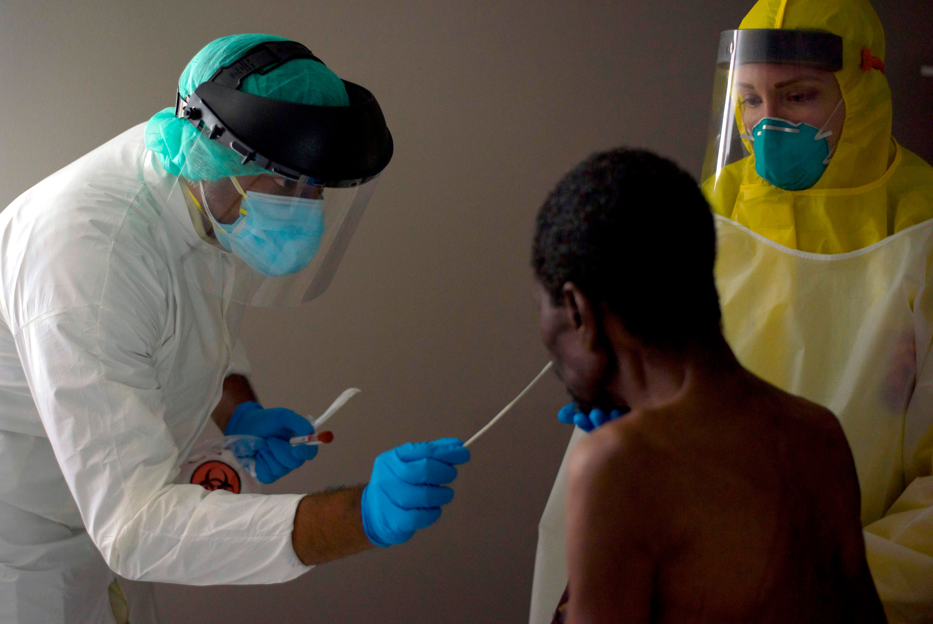 A healthcare worker conducts a coronavirus test at United Memorial Medical Center in Houston, Texas, on July 2.