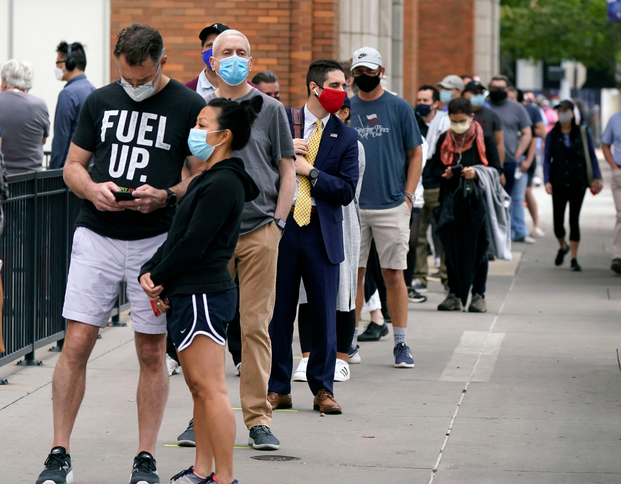 Voters wait to cast a ballot at the American Airlines Center during early voting on October 15 in Dallas.