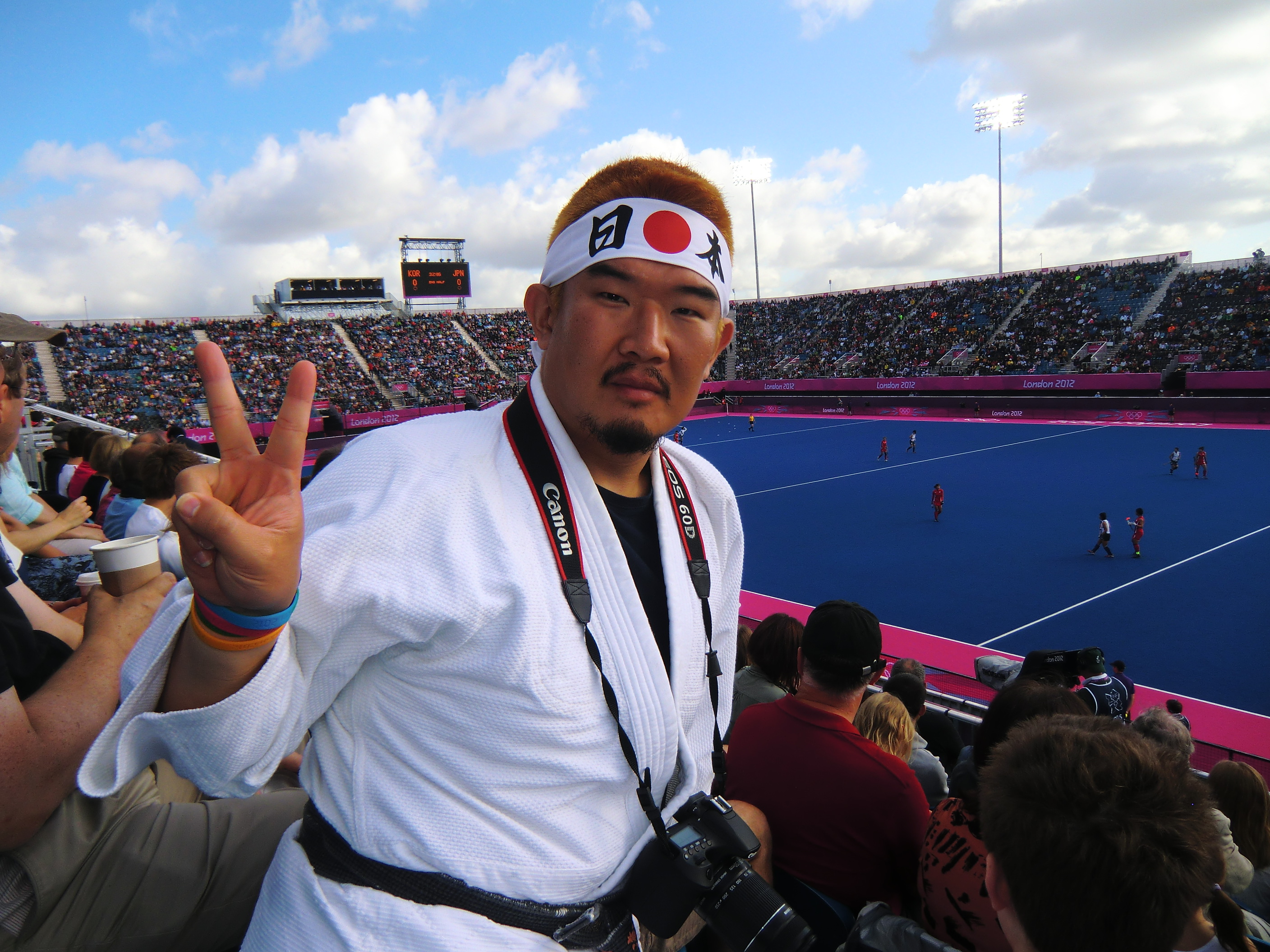 Kazunori Takishima attends a hockey match at the 2012 Olympics in London. 