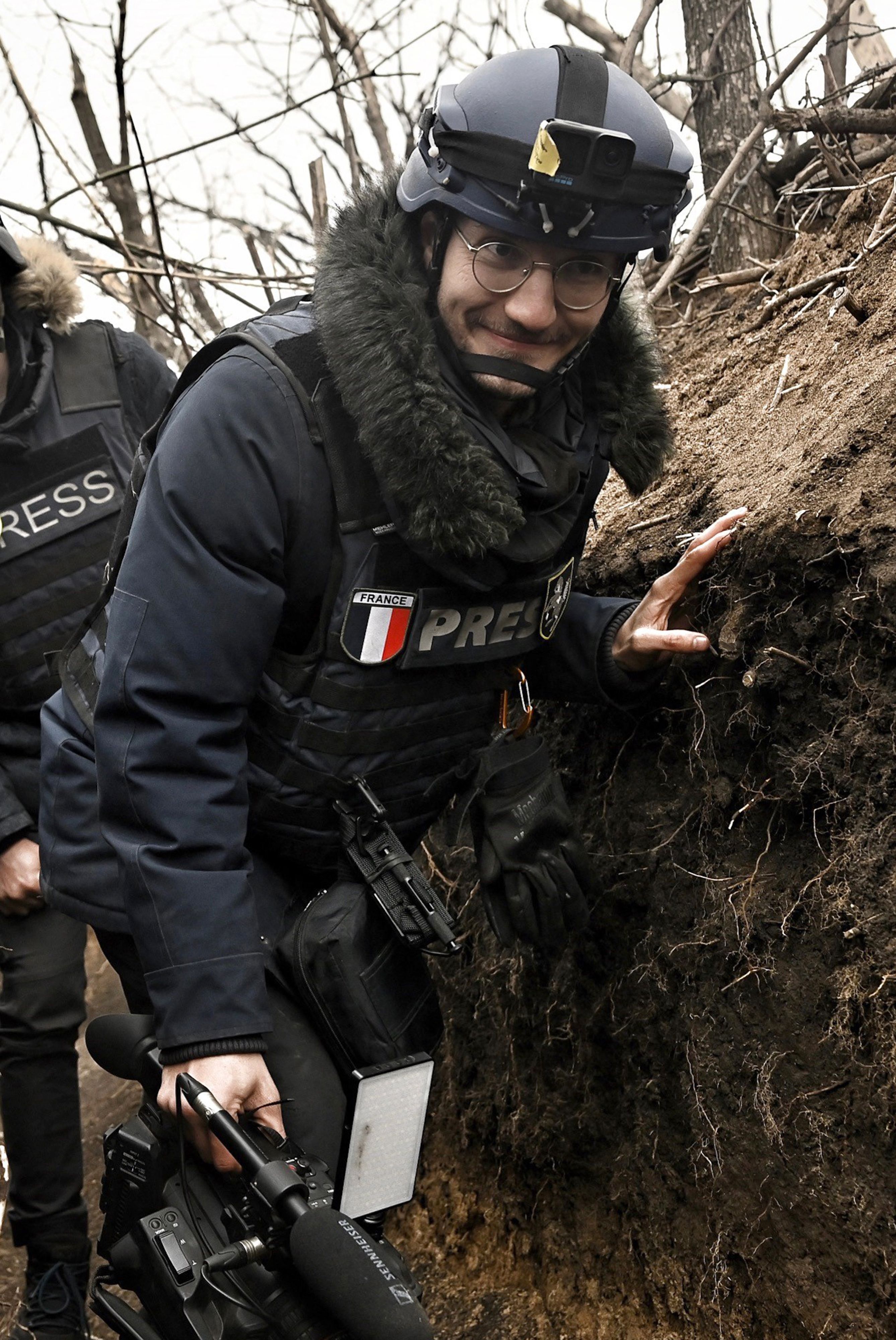 Arman Soldin, a video journalist for Agence France-Presse, walks in a trench as he covers the war in Ukraine on March 18, 2023.