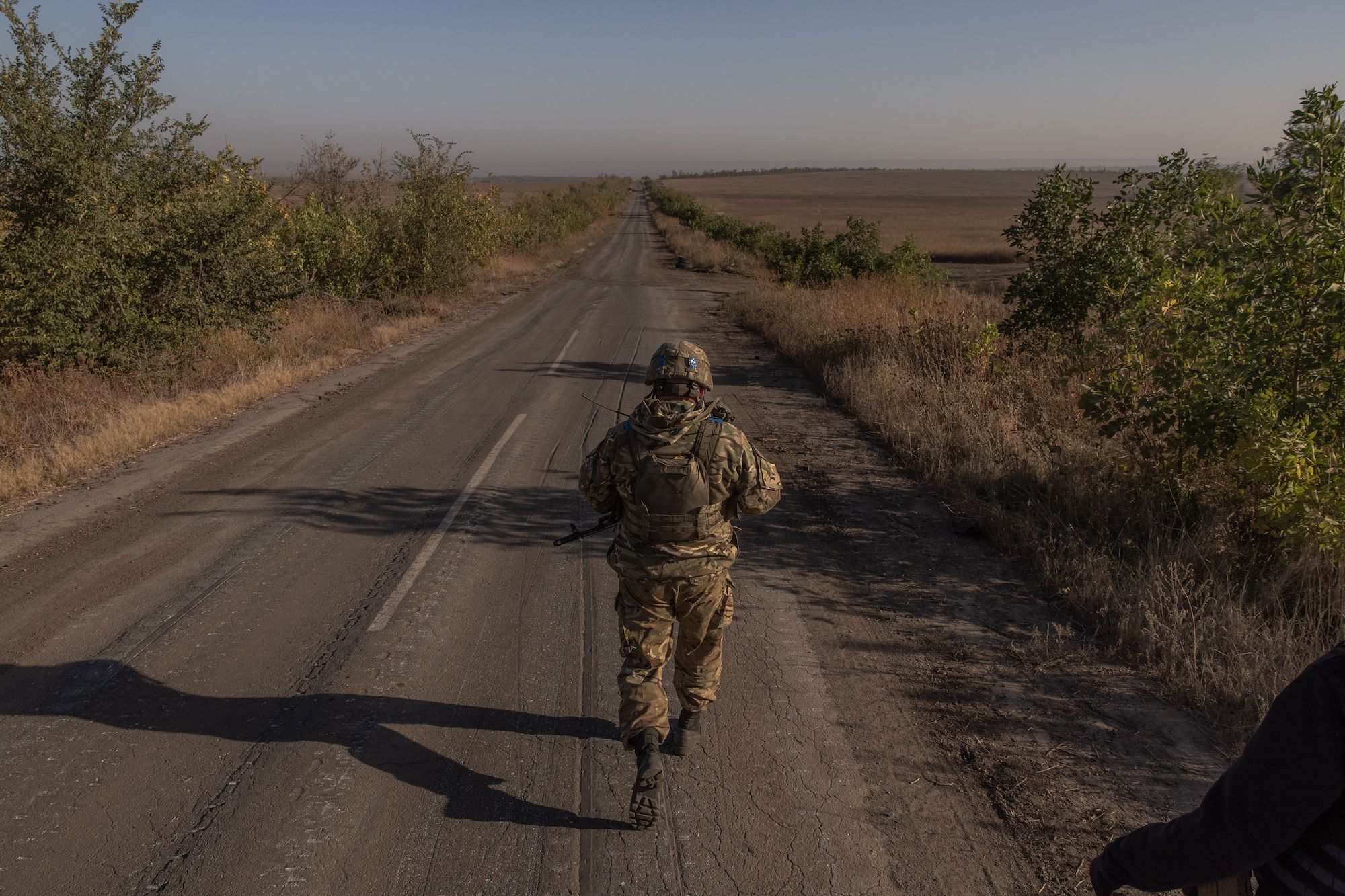 A Ukrainian soldier is seen on a road near the frontline in the Zaporizhzhia region on Sunday.