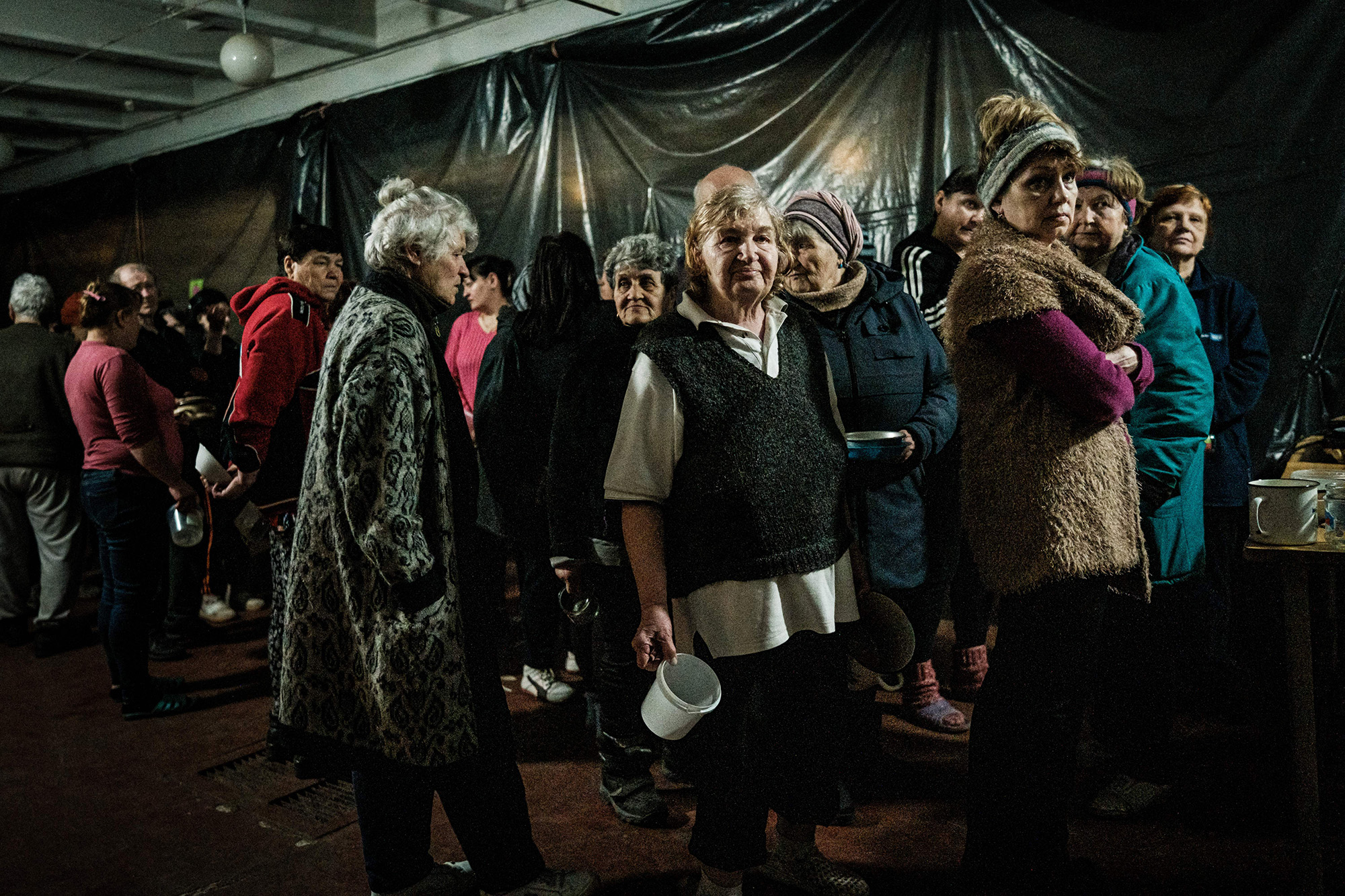 Internally displaced people wait for food distribution in a bunker at a factory in Severodonetsk, eastern Ukraine, on April 22.