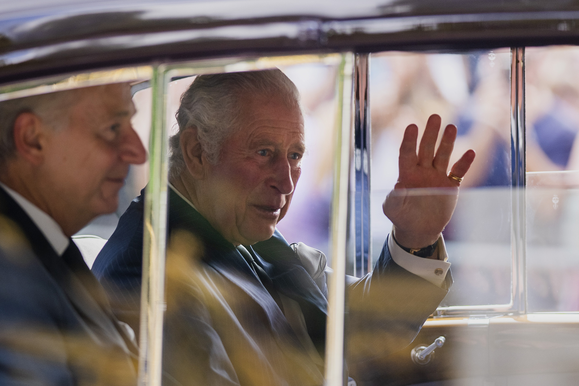 King Charles III greets supporters as he arrives at Buckingham Palace in London, Sunday, September 11, 2022. 