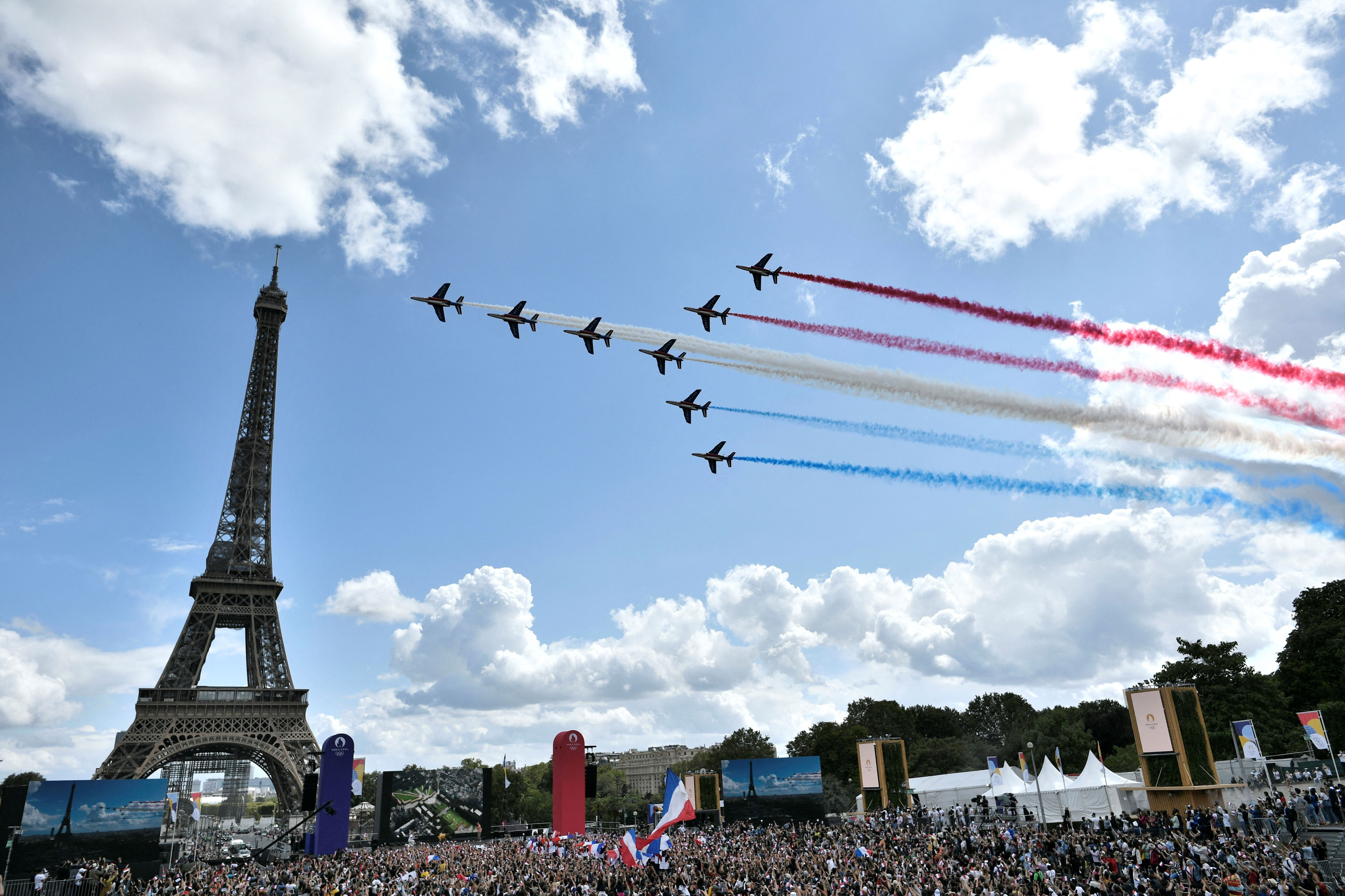 The Patrouille de France fly over celebrations at the Trocadéro in Paris.