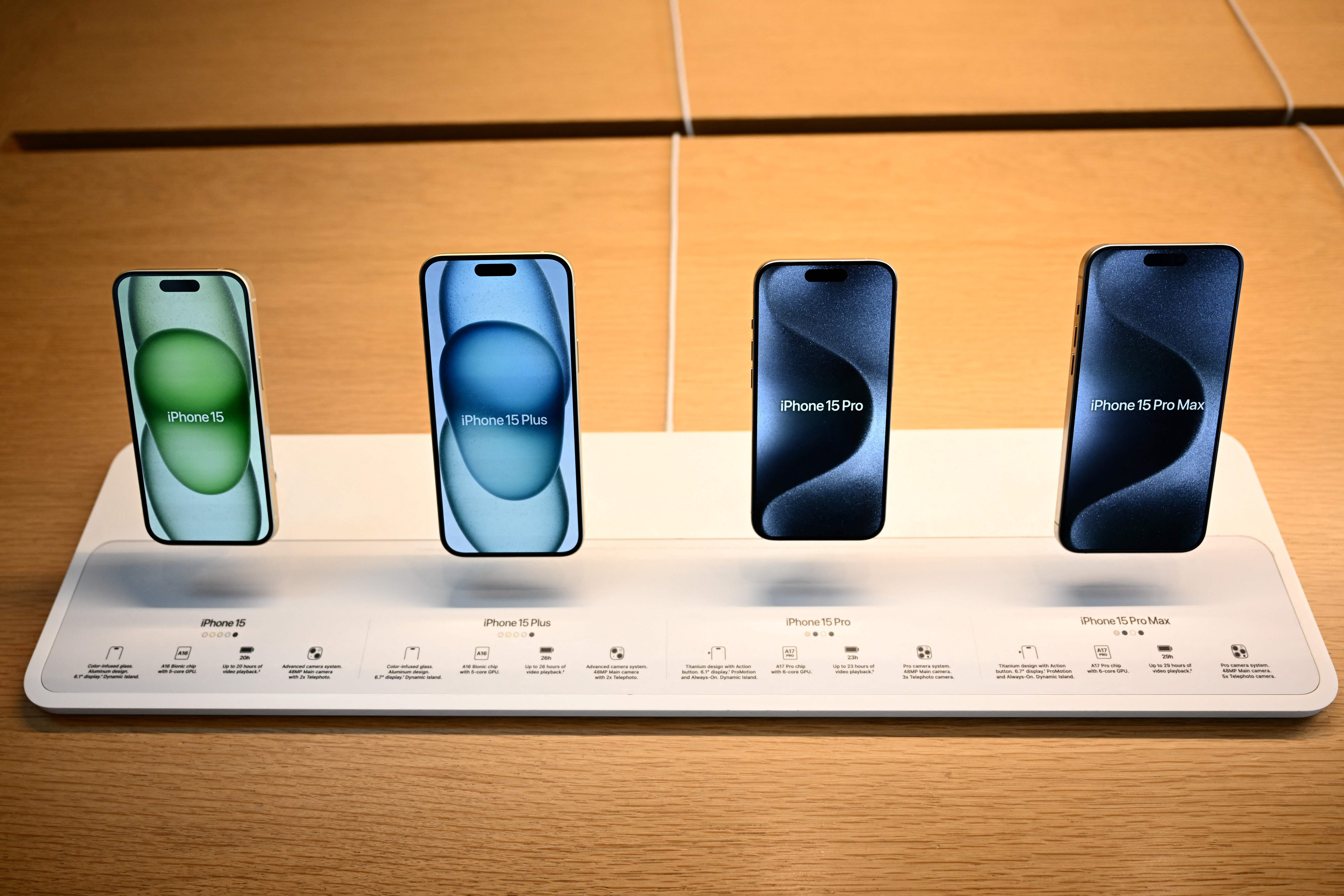 Apple iPhone 15 models are displayed at a store on the products’ release day in Los Angeles on September 22.