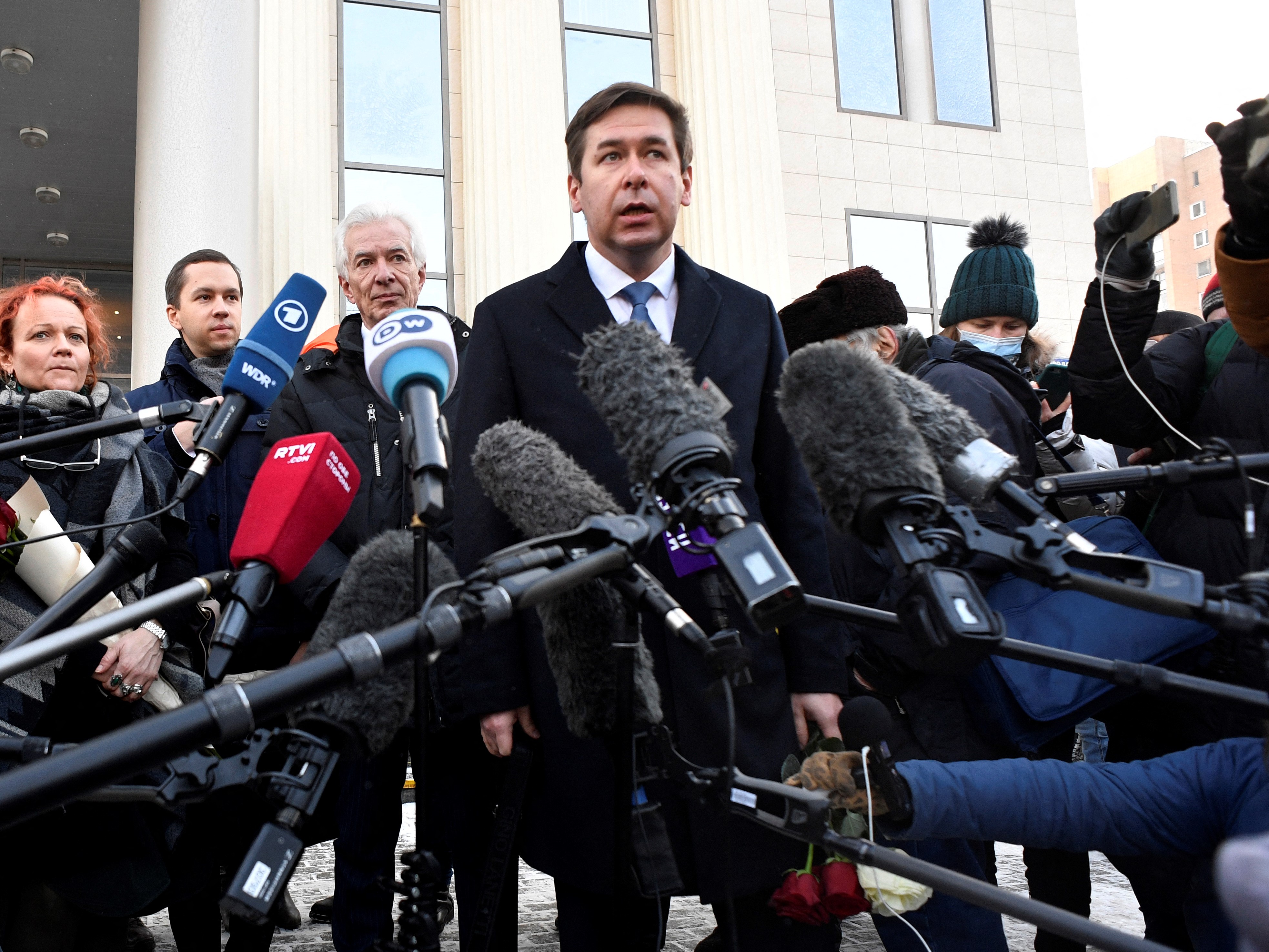 Lawyer of the human rights group 'Memorial' Ilya Novikov, center, speaks to the media after Moscow City Court ordered the closure of a branch of the Memorial group, in Moscow, Russia, on December 29.