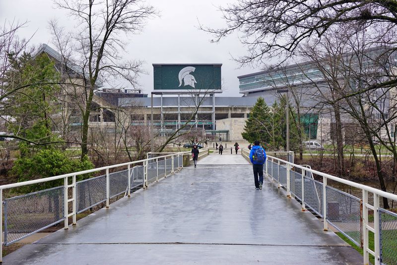 In this April 7, 2016 file photo, students walk on campus at Michigan State University in East Lansing, Michigan.