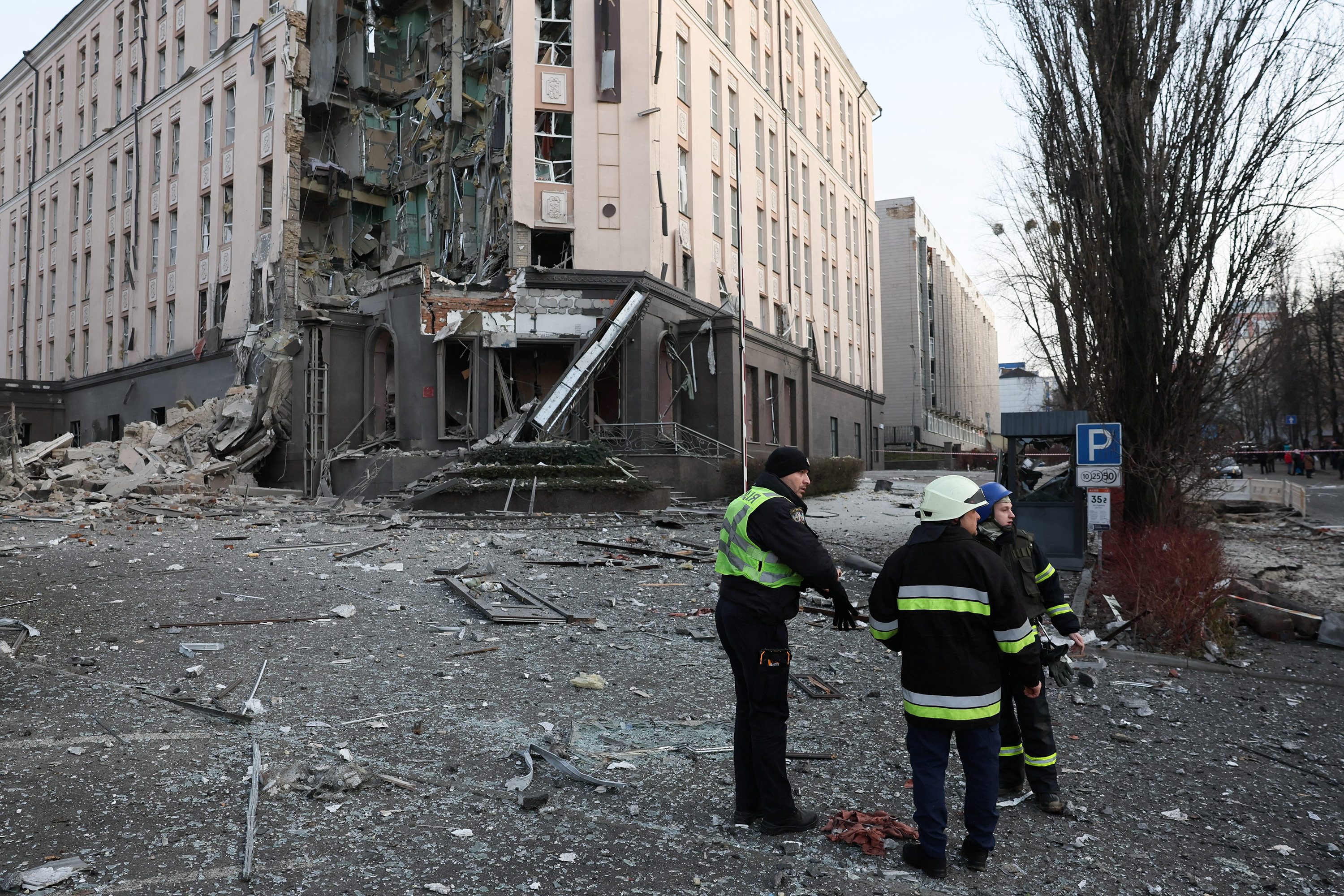 Rescuers work at the site of a building damaged after a Russian missile strike in Kyiv, Ukraine, on December 31.