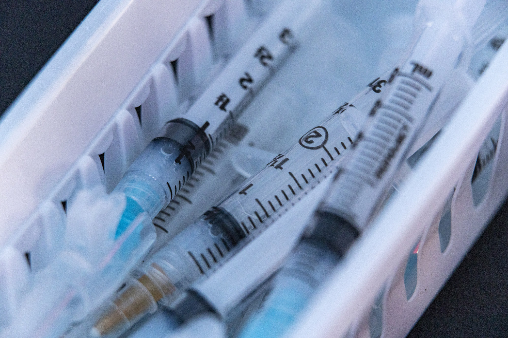 Syringes with doses of the Moderna Covid-19 vaccine are seen at a drive-thru vaccination site in Pomeroy, Ohio, in March.