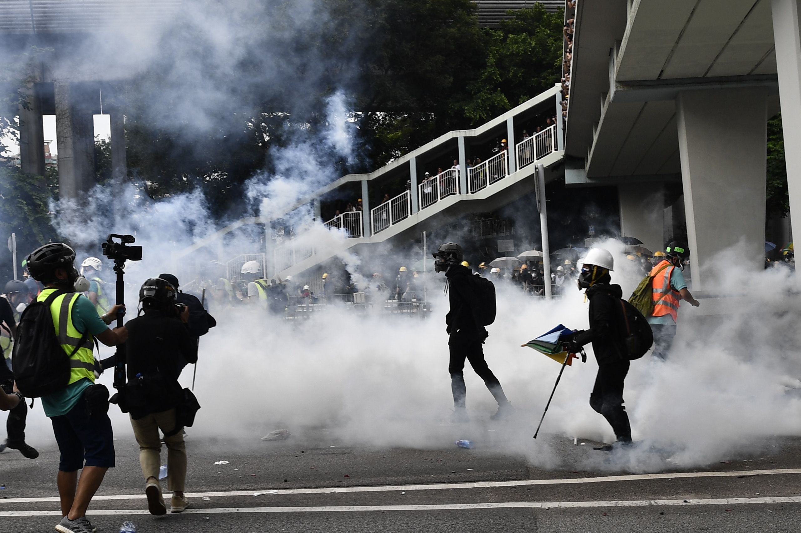 Hong Kong police fire tear gas during demonstration in the district of Yuen Long in Hong Kong on July 27.