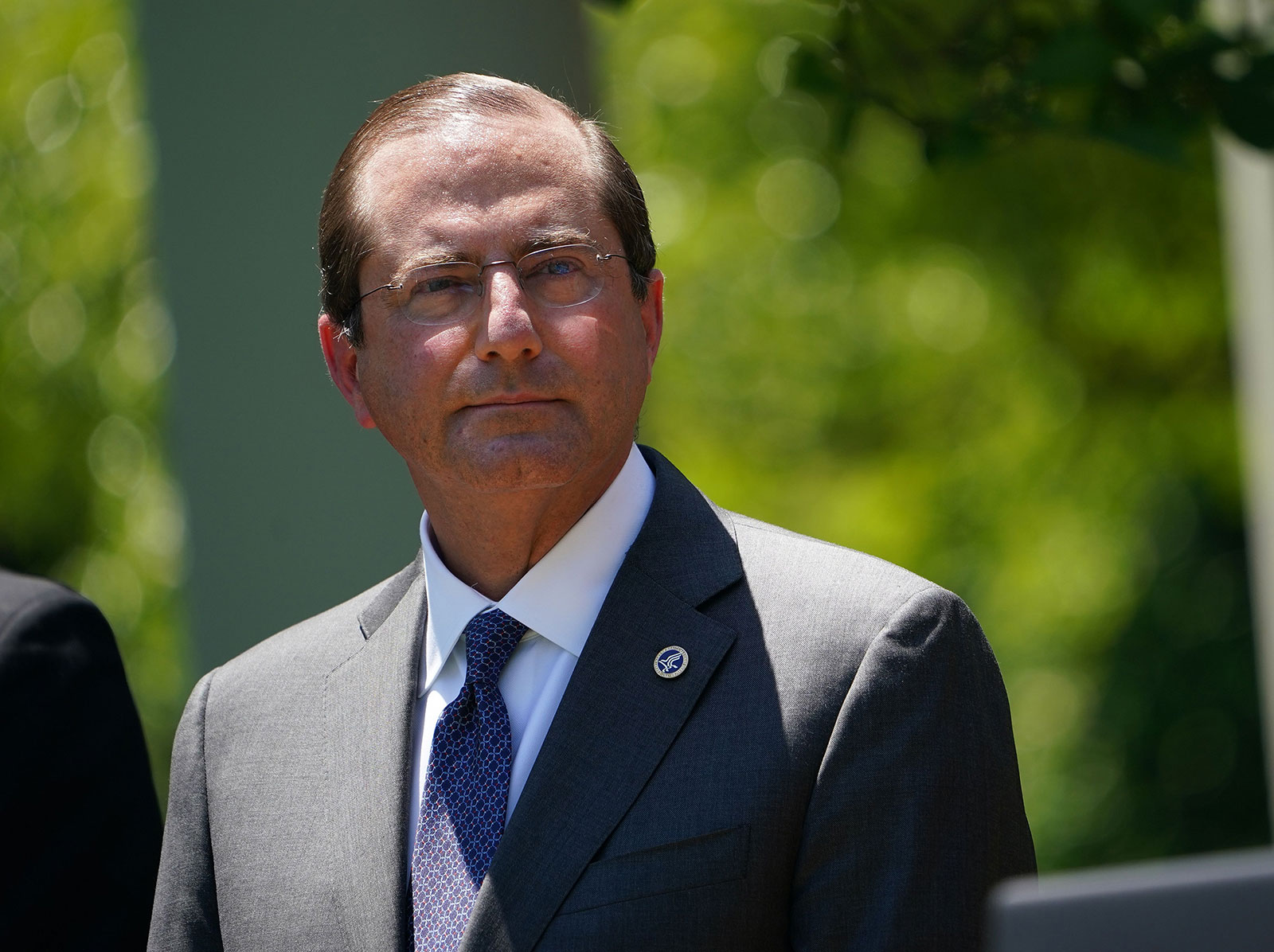 Health and Human Services Secretary Alex Azar listens during a vaccine development announcement from the Rose Garden of the White House on May 15.