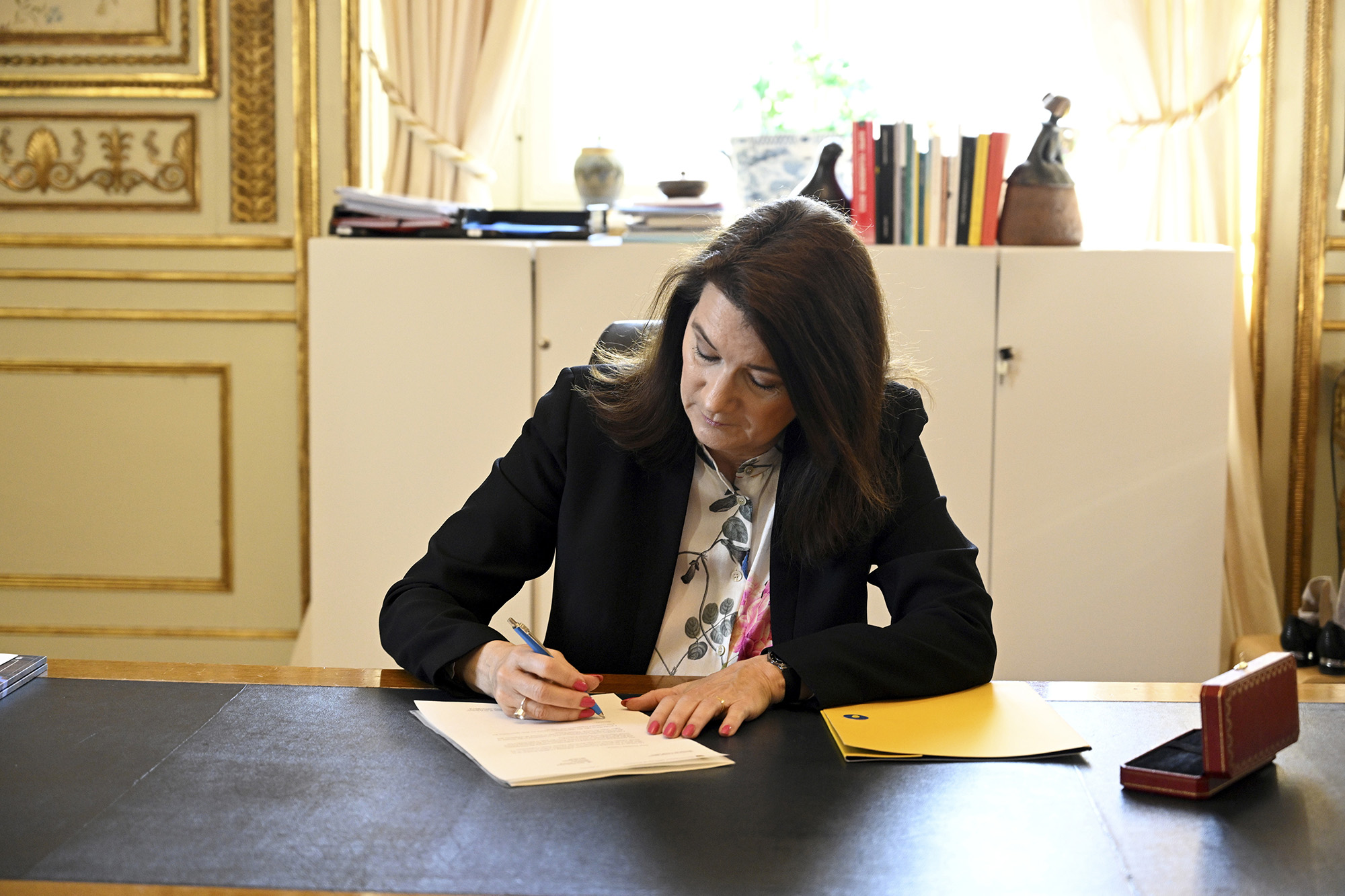 Swedish Minister of Foreign Affairs Ann Linde signs Sweden's application for NATO membership at the Ministry of Foreign Affairs in Stockholm on May 17.