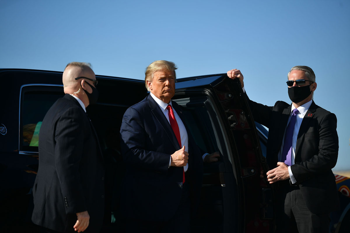 President Donald Trump makes his way to board Air Force One before departing from Andrews Air Force Base in Maryland on October 17. Trump will be heading on a three-day campaign trip which will take him to Michigan, Wisconsin, Nevada, and Arizona.