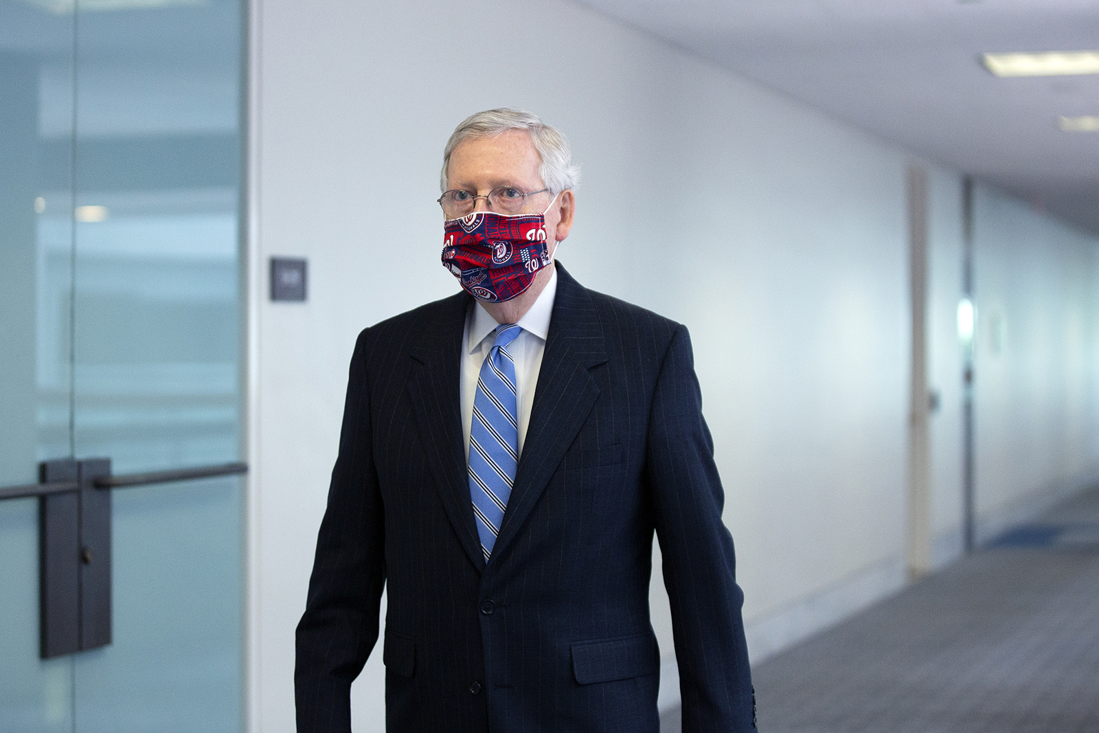Senate Majority Leader Mitch McConnell, wears a protective mask while arriving to a Senate Republican luncheon on Capitol Hill in Washington, DC on June 25.