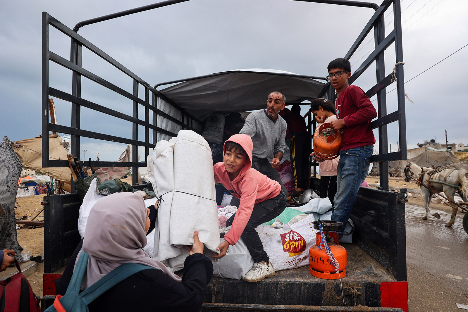 Palestinians pack their belongings as they prepare to flee Rafah in southern Gaza on May 13. 