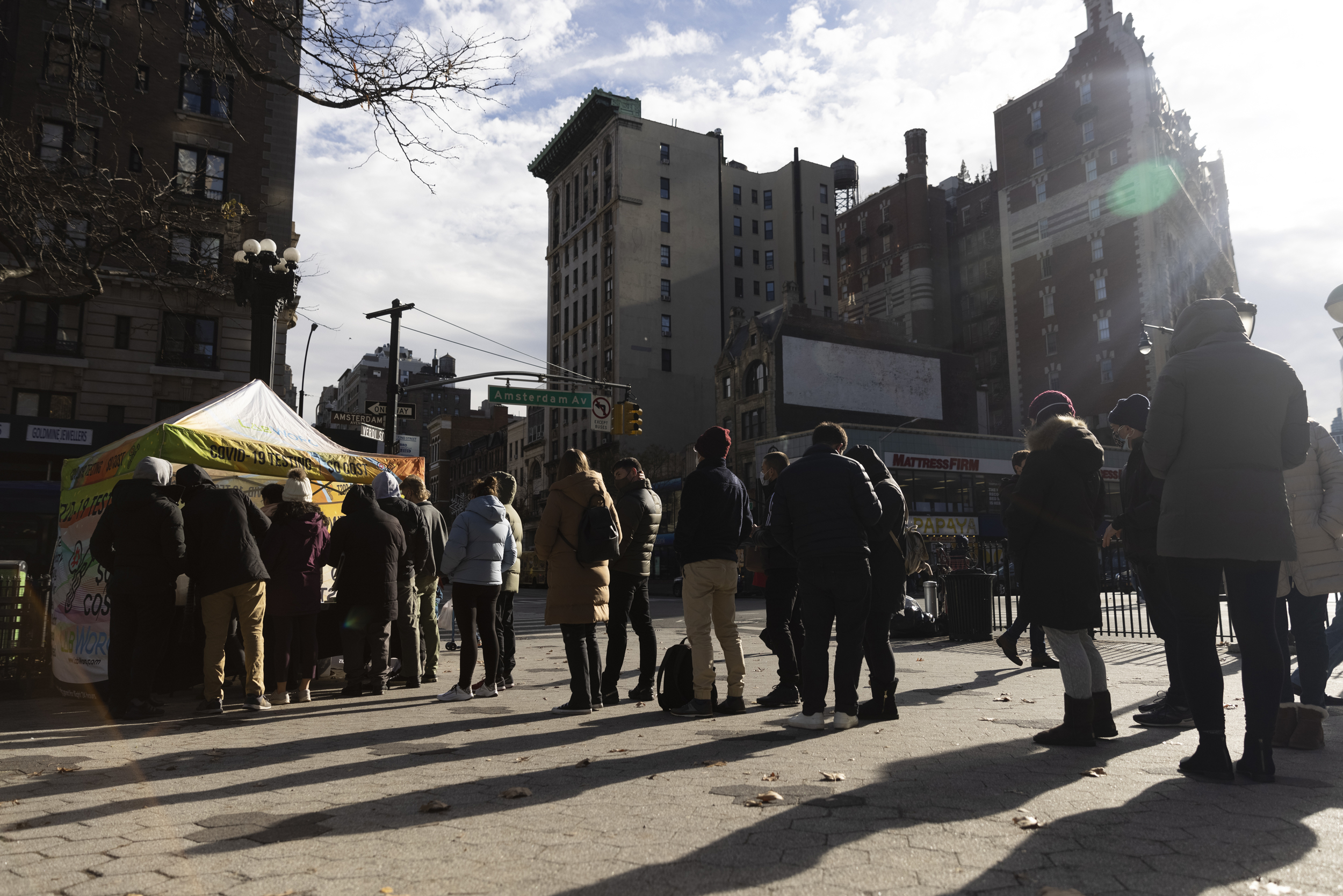 People wait in line outside a Covid-19 mobile testing site in the Upper West Side neighborhood of New York, on Sunday, December 19.