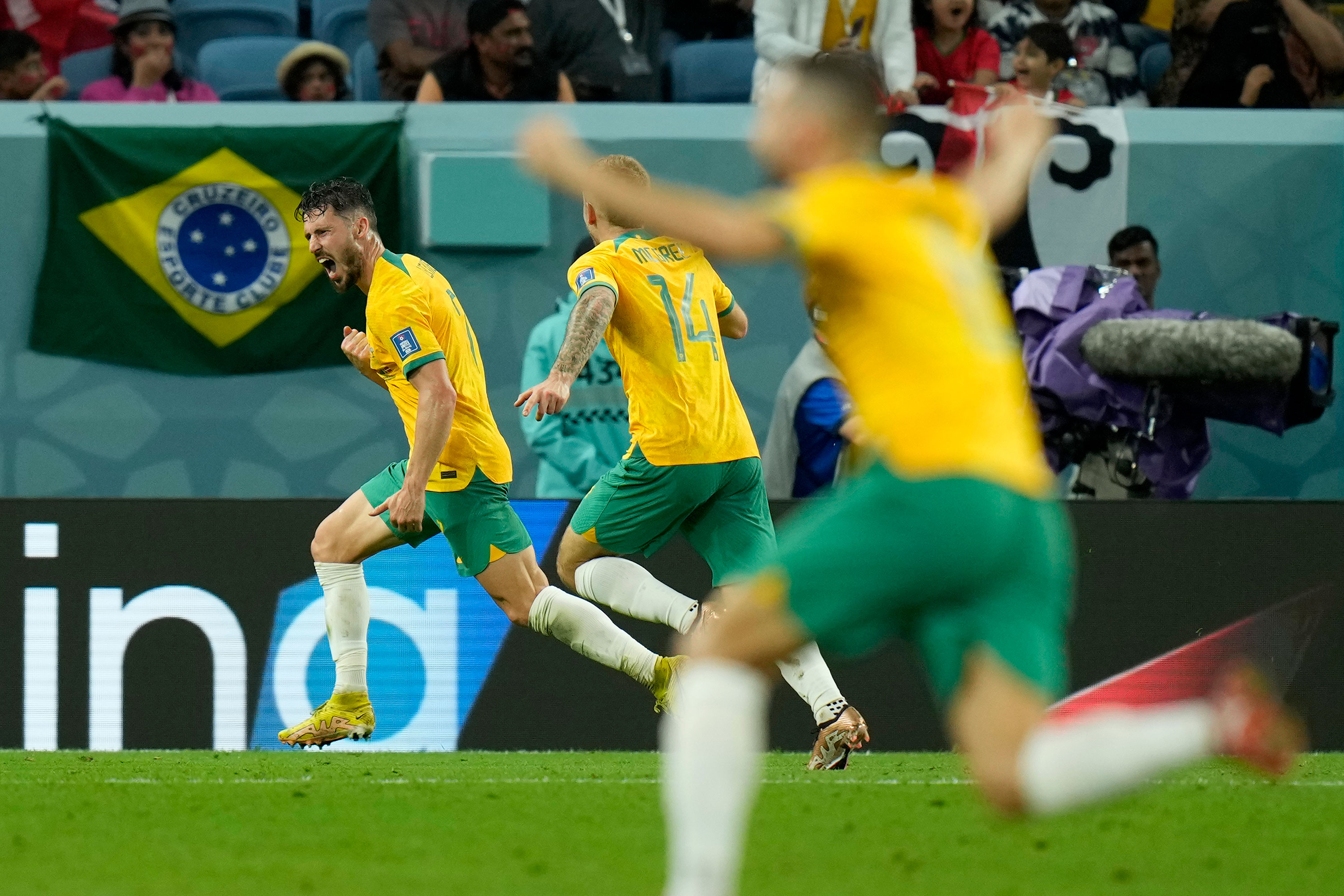 Australia's Mathew Leckie, left, celebrates after scoring a goal against Denmark on Wednesday.