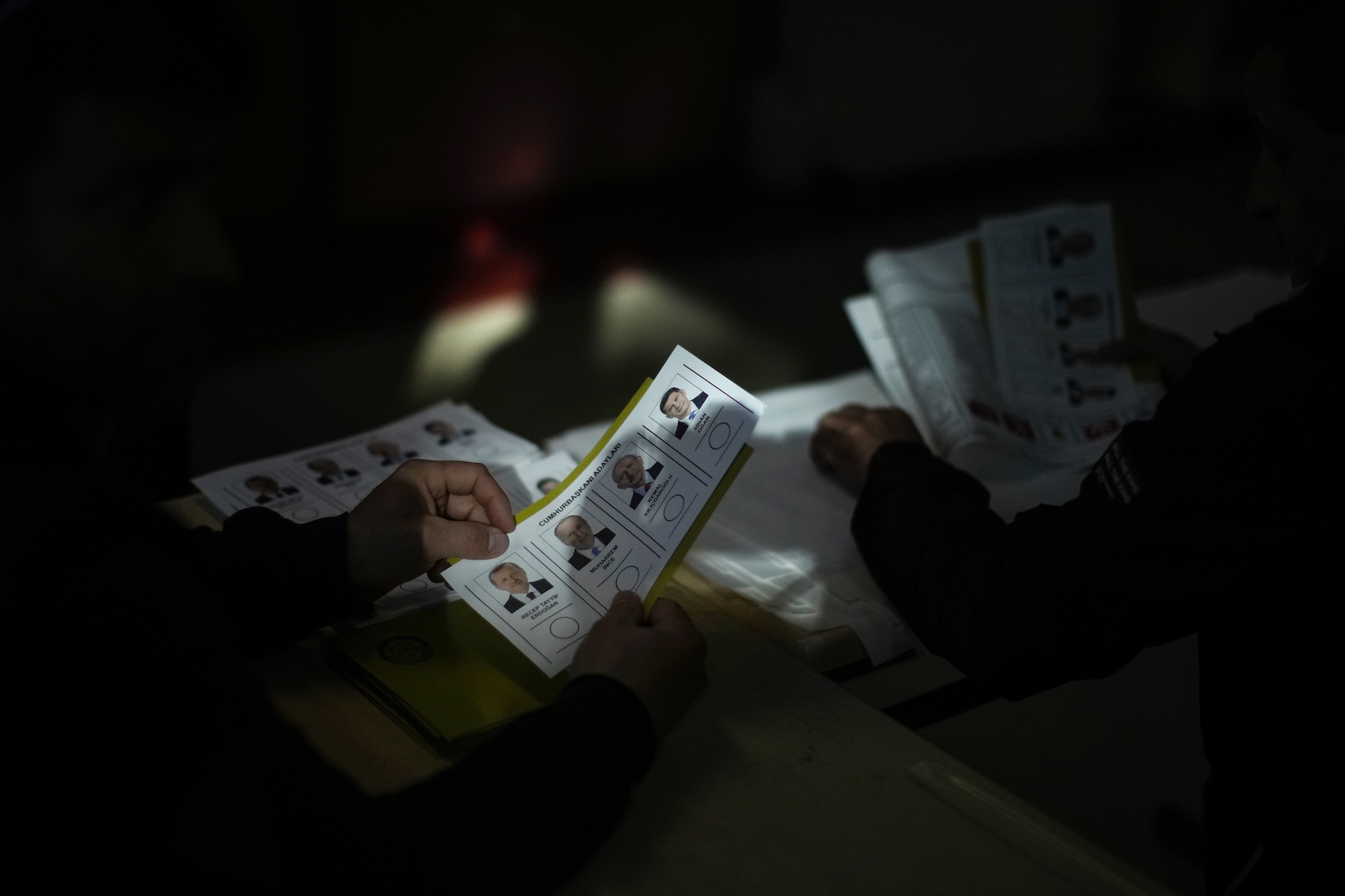 Election representatives prepare ballots at a polling station in Istanbul on Sunday.