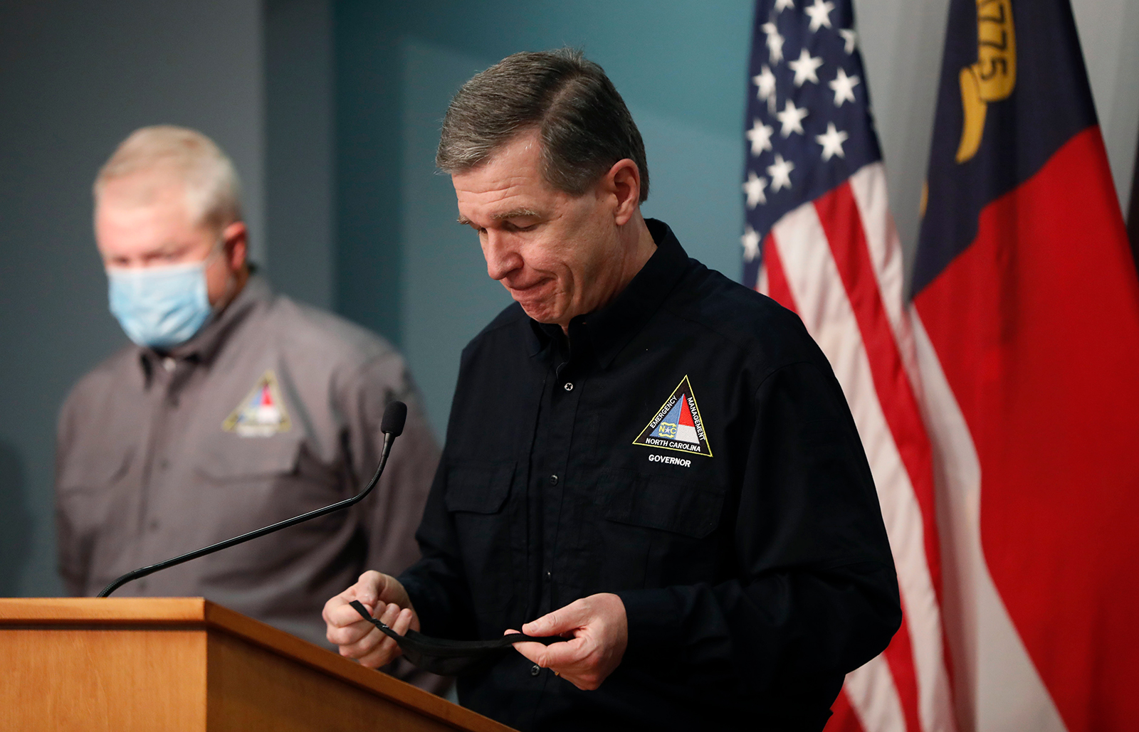 North Carolina Gov. Roy Cooper leaves the podium after a press conference about the state's preparations for then-Tropical Storm Isaias on Sunday, August 2, in Raleigh.