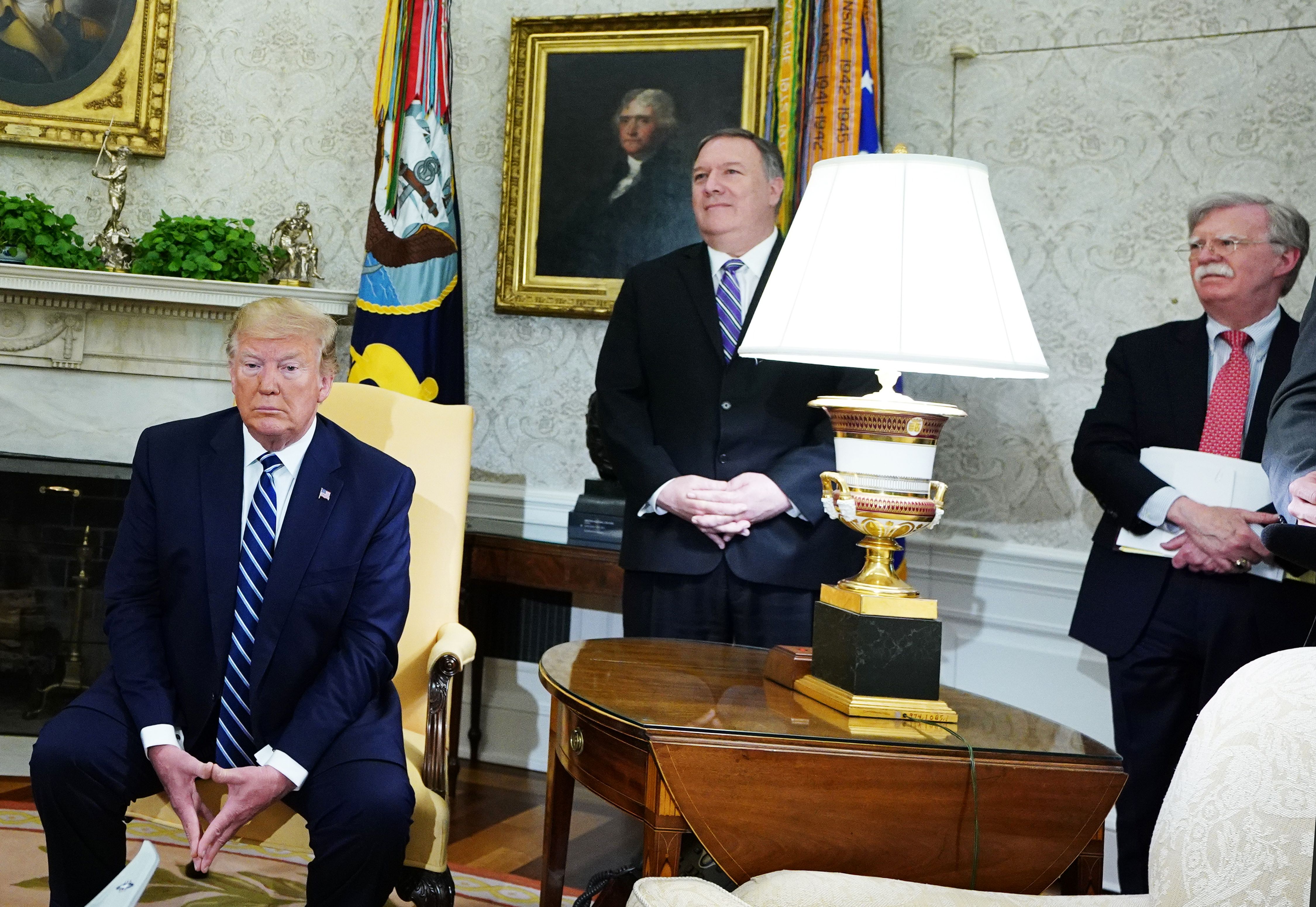 President Trump, Secretary of State Mike Pompeo, and national security adviser John Bolton are seen during a bilateral meeting with Canada's Prime Minister Justin Trudeau in the Oval Office on June 20, 2019.