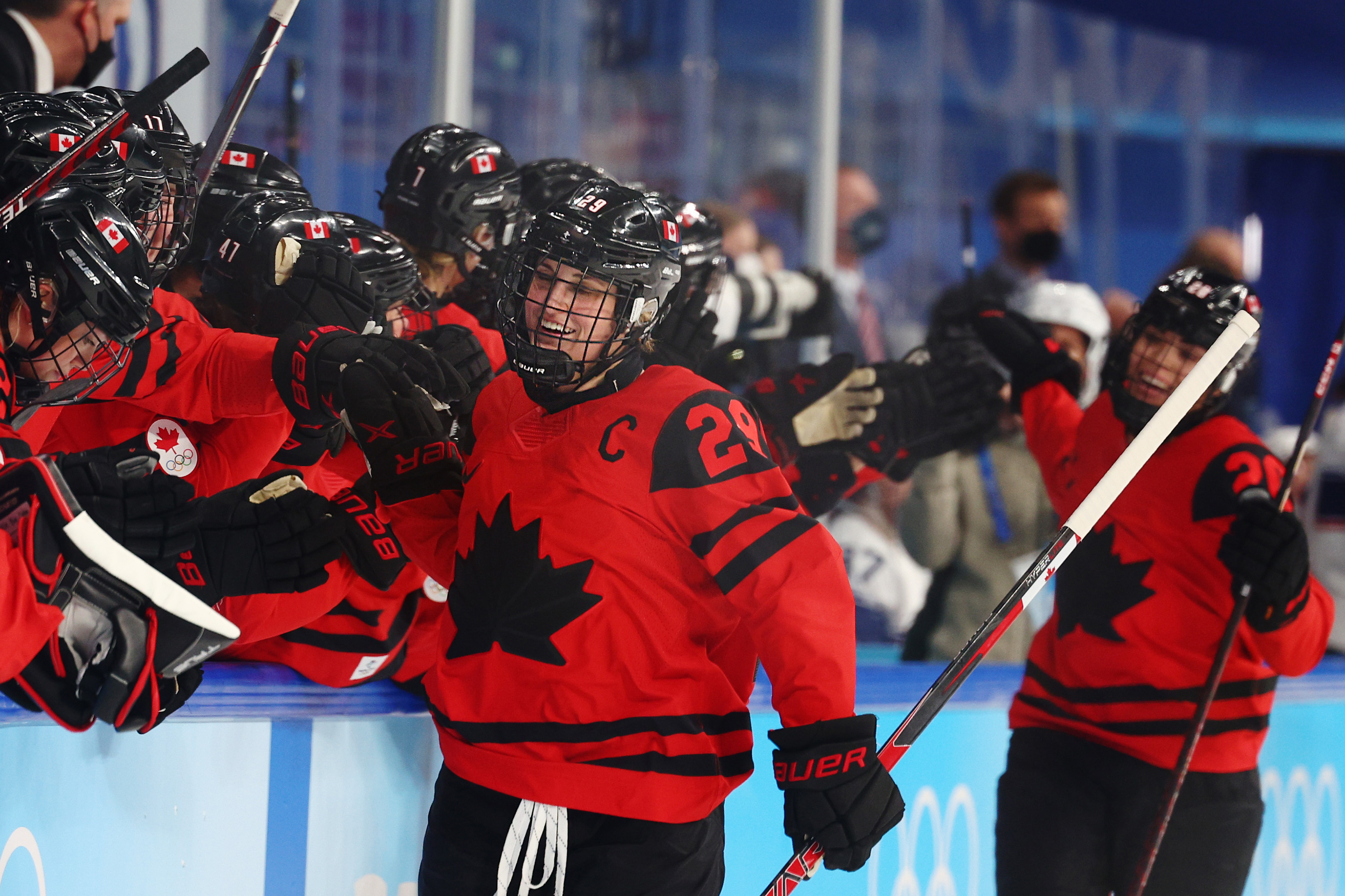Team Canada's Marie-Philip Poulin #29 celebrates with teammates on the bench after scoring a goal in the first period during the women's ice hockey gold medal match between Team Canada and Team USA on Thursday.