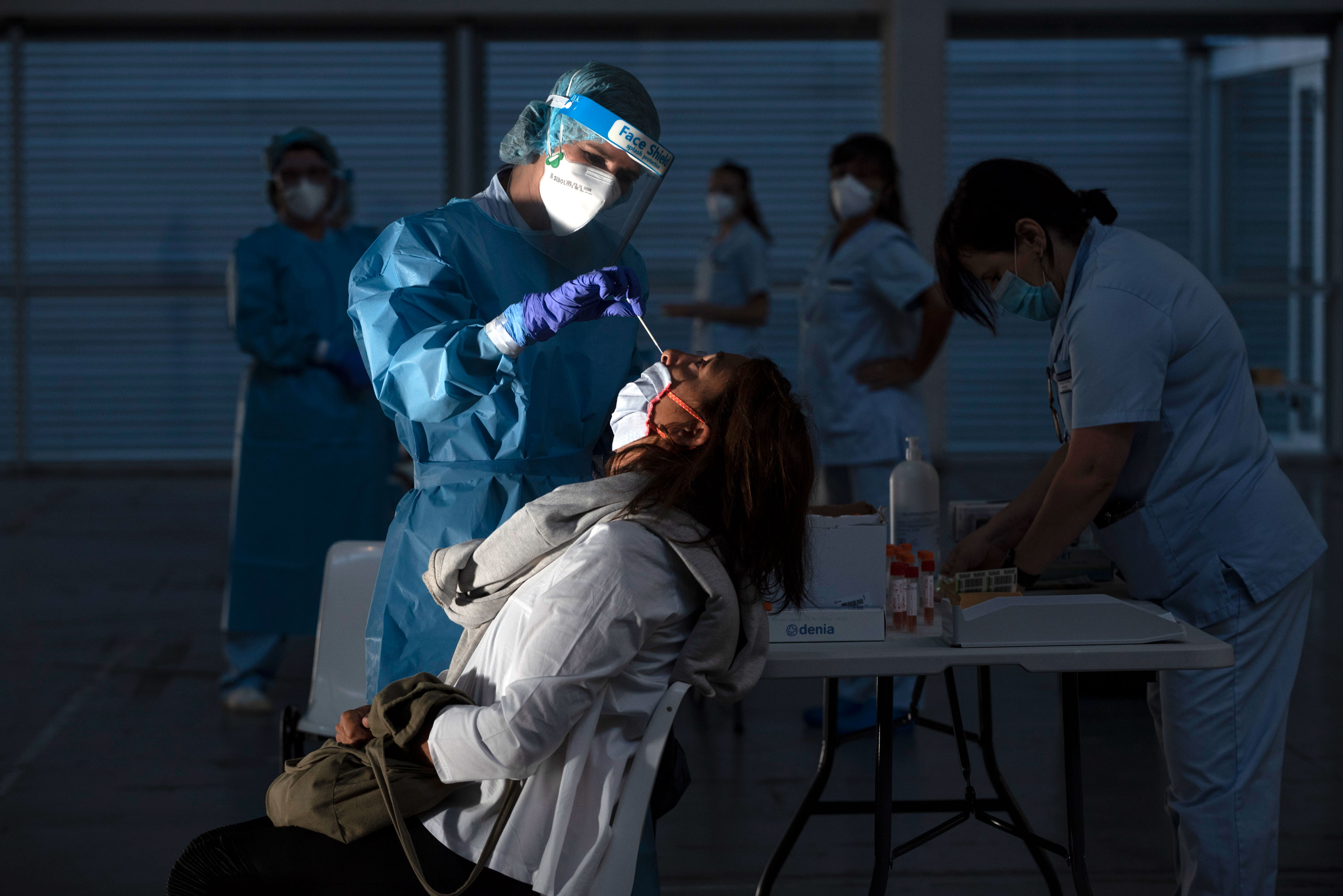A health worker in Irun, Spain, tests someone for Covid-19 on September 3.