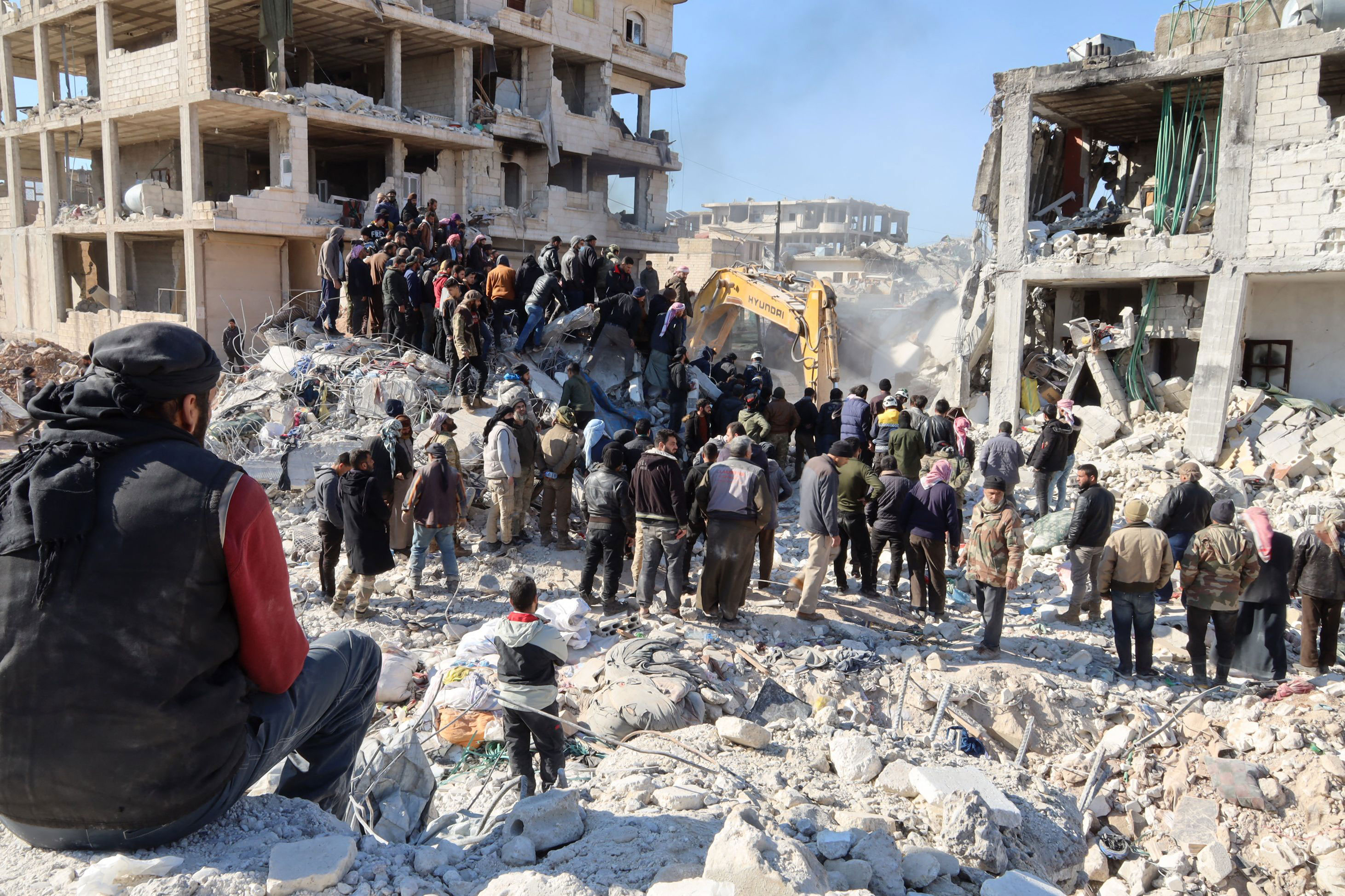 Rescue workers look for survivors amid the rubble of a building in Jindayris, Syria on February 9. 