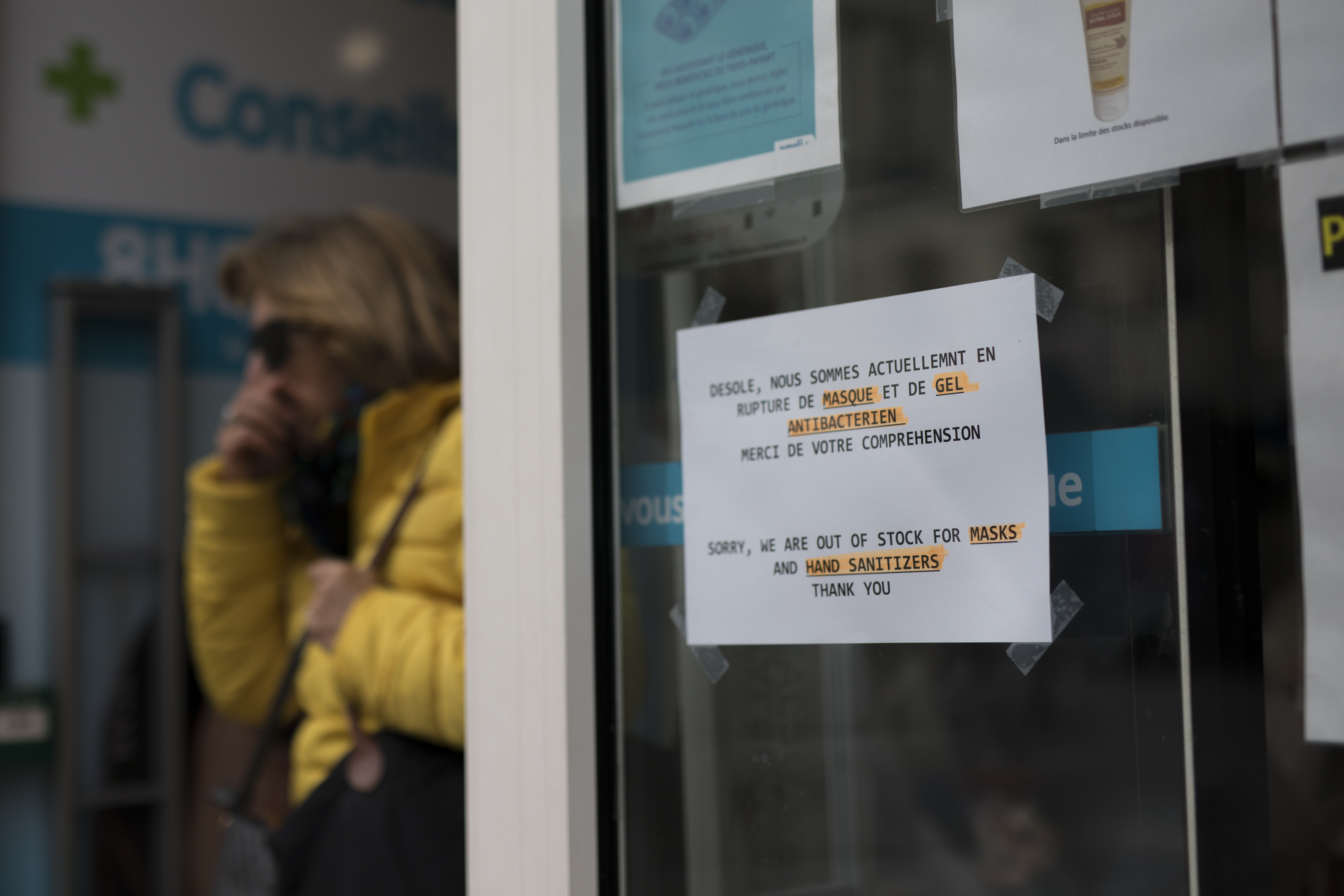 A sign is displayed at the entrance to a pharmacy in Marseille, southern France, on Tuesday, March 3.