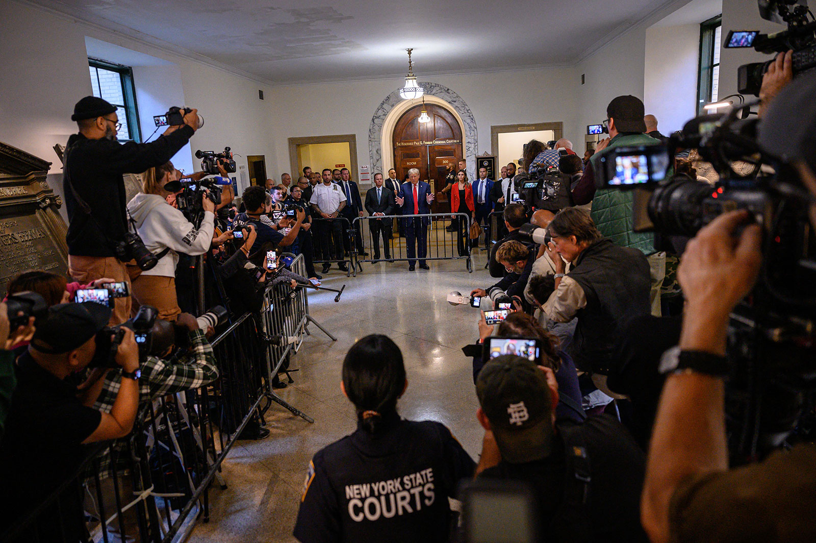 Trump speaks to the media as he arrives to court on Tuesday. He continued to attack Judge Arthur Engoron and New York Attorney General Letitia James.