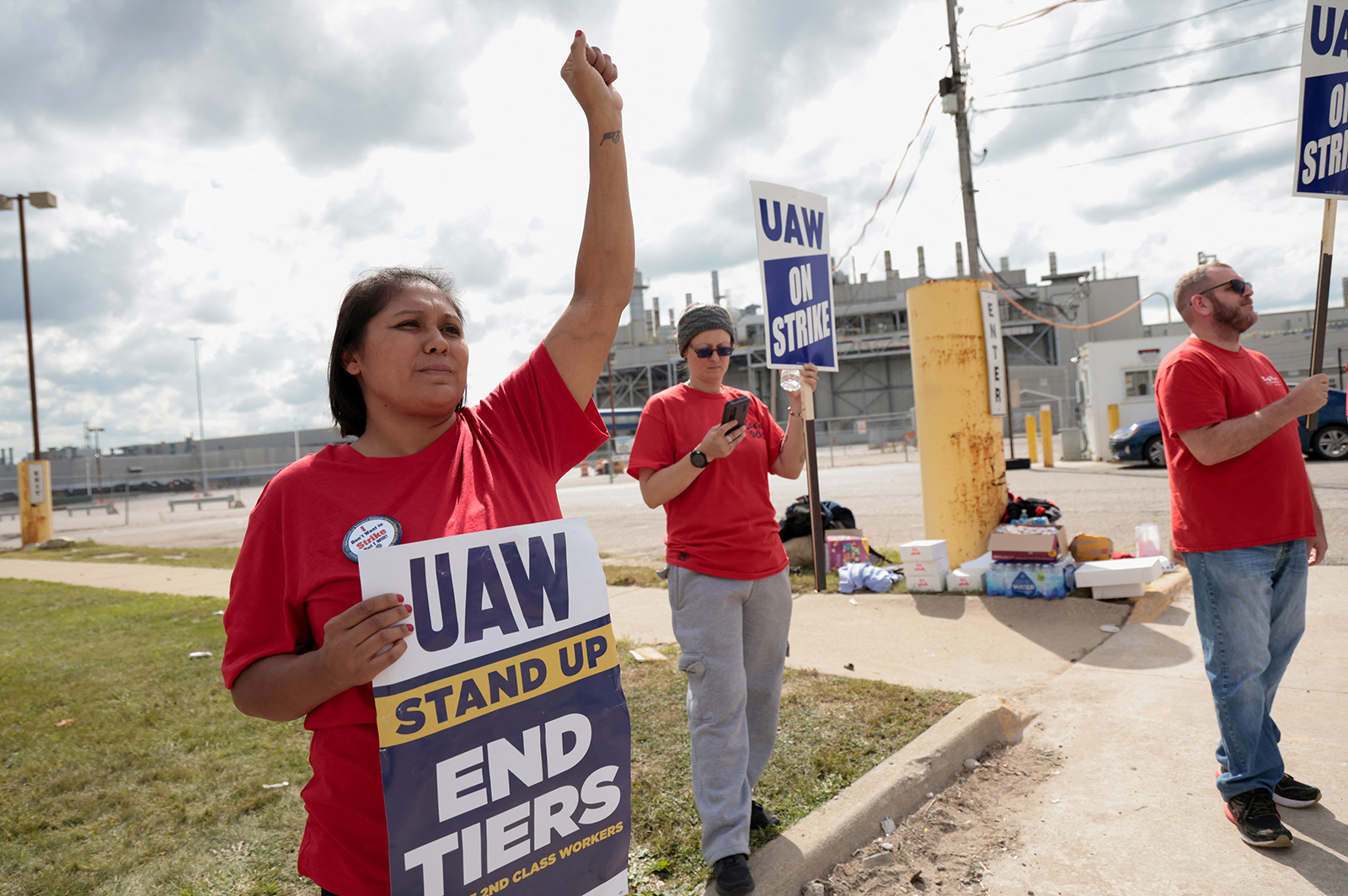 Striking United Auto Worker Diana Osborne holds a strike sign outside the Ford Michigan Assembly Plant in Wayne, Michigan, U.S. September 15, 2023. 