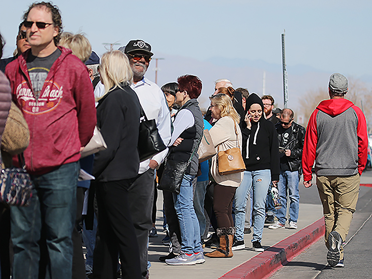  People wait in line to vote on the final day of early voting for the upcoming Nevada Democratic presidential caucus on Tuesday, February 18, in Henderson, Nevada.