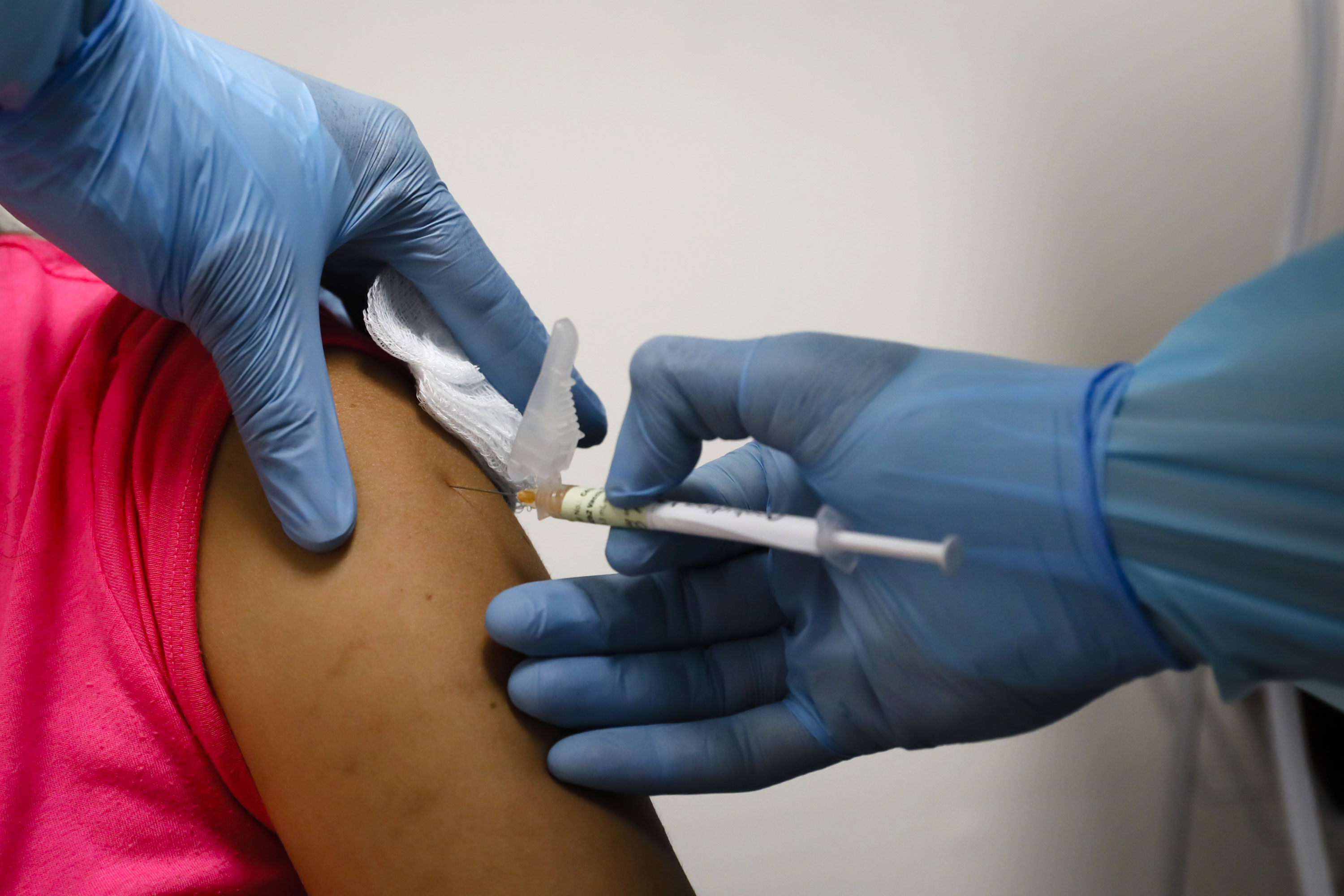 A health worker in Hollywood, Florida, injects a person during clinical trials for a Pfizer coronavirus vaccine on September 9.