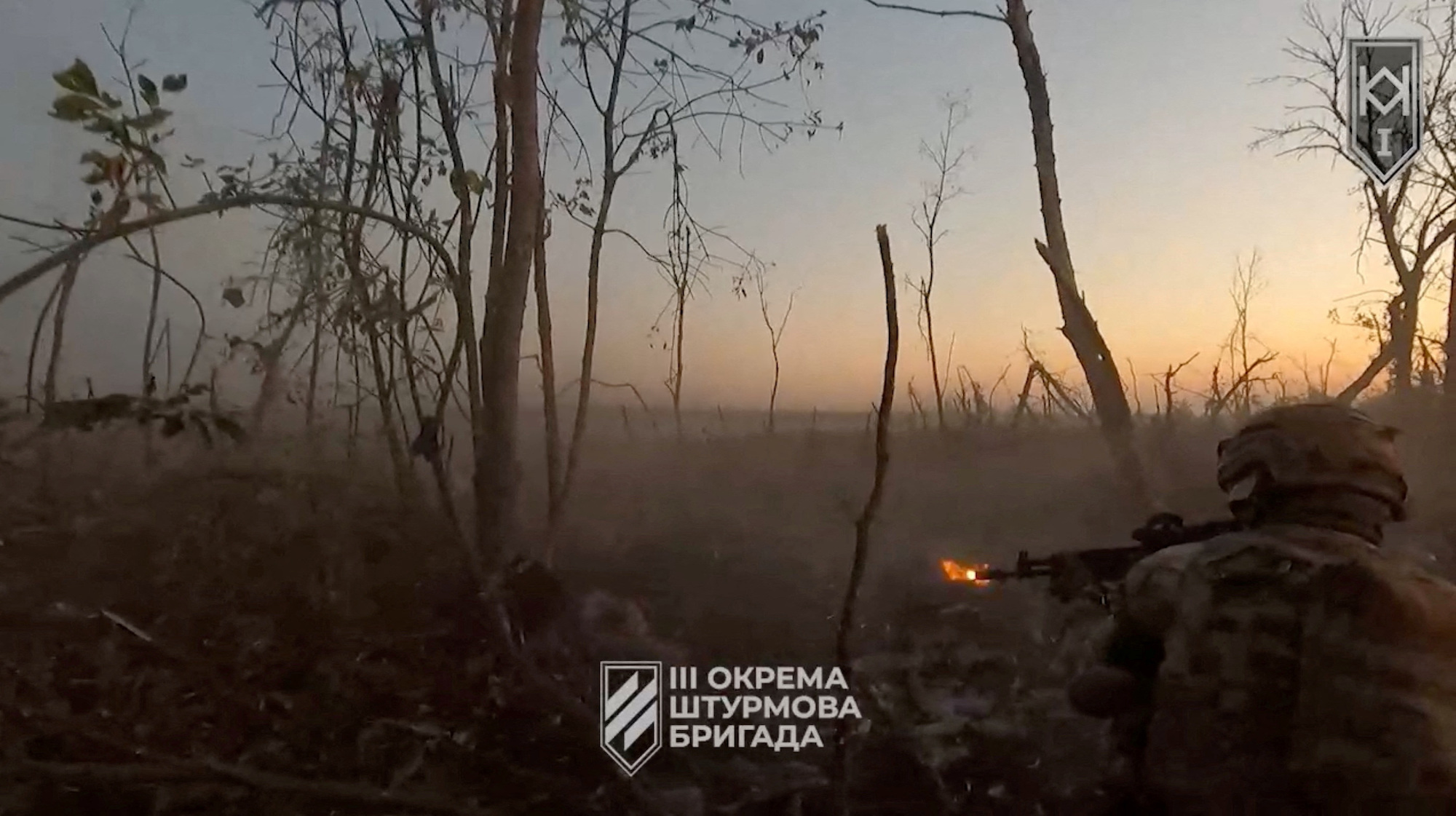 A Ukrainian soldier shoots from his position near Bakhmut in the Donetsk Region, on Saturday.