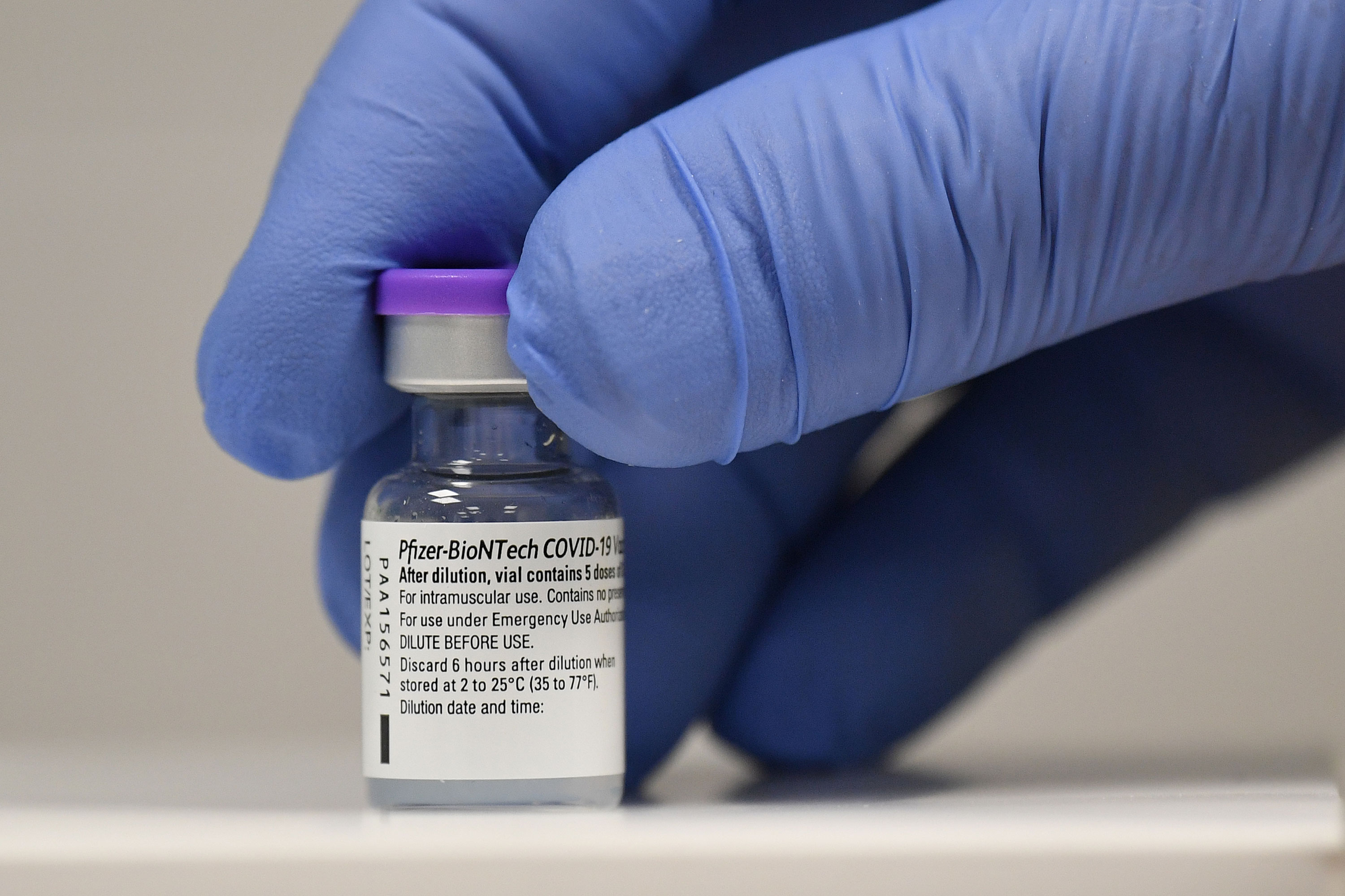 A vial of Pfizer-BioNTech's Covid-19 vaccine is seen at a vaccination health center in December in Cardiff, United Kingdom.