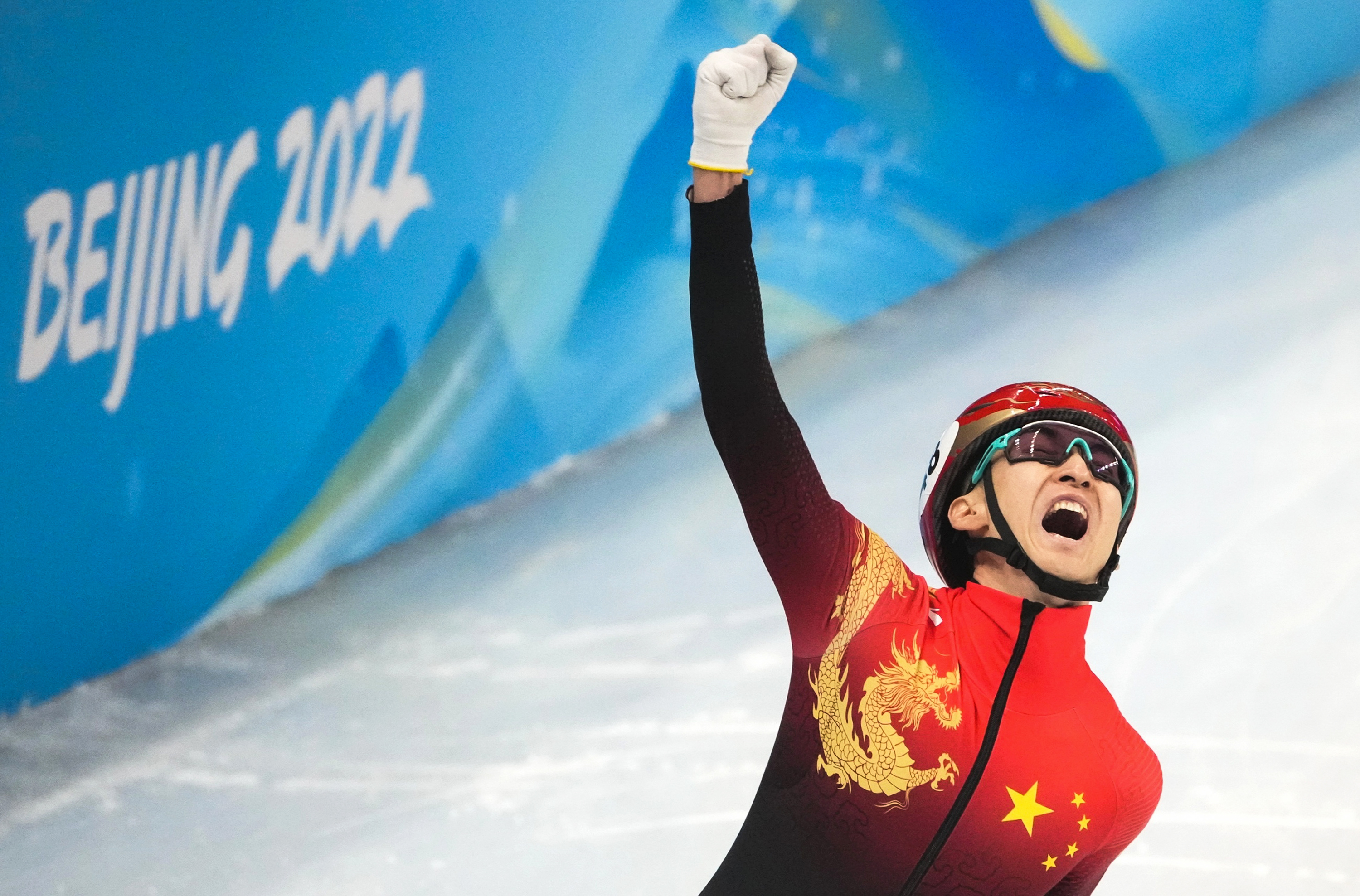 China's Wu Dajing celebrates after winning the short track speed skating mixed relay on Saturday.