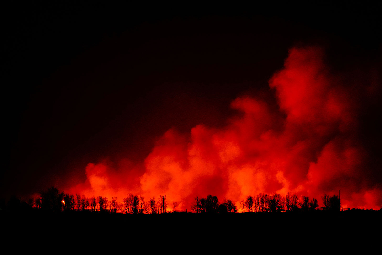 A wildfire burns outside of Shattuck, Oklahoma, on Tuesday.