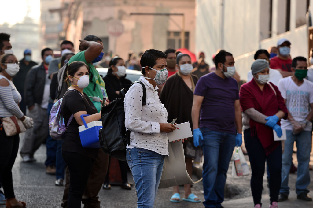 People wearing face masks on a street of Tegucigalpa, Honduras, on Monday.