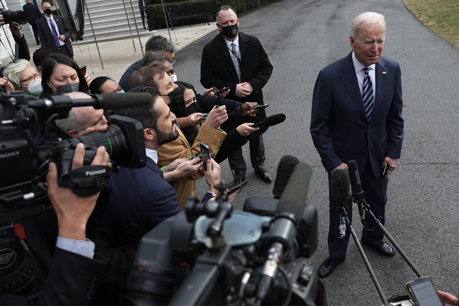 President Joe Biden speaks to members of the press prior to departing for Cleveland, on February 17. 