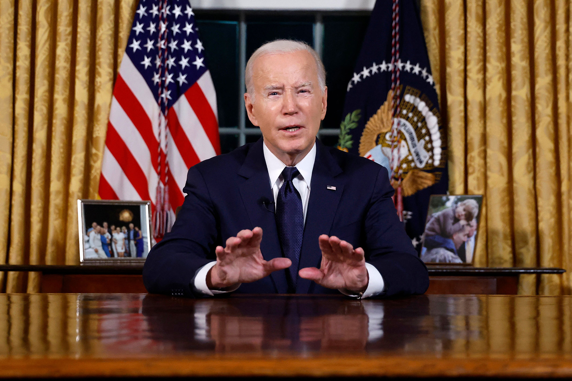 US President Joe Biden addresses the nation on the conflict between Israel and Gaza and the Russian invasion of Ukraine from the Oval Office of the White House in Washington, DC, on October 19.