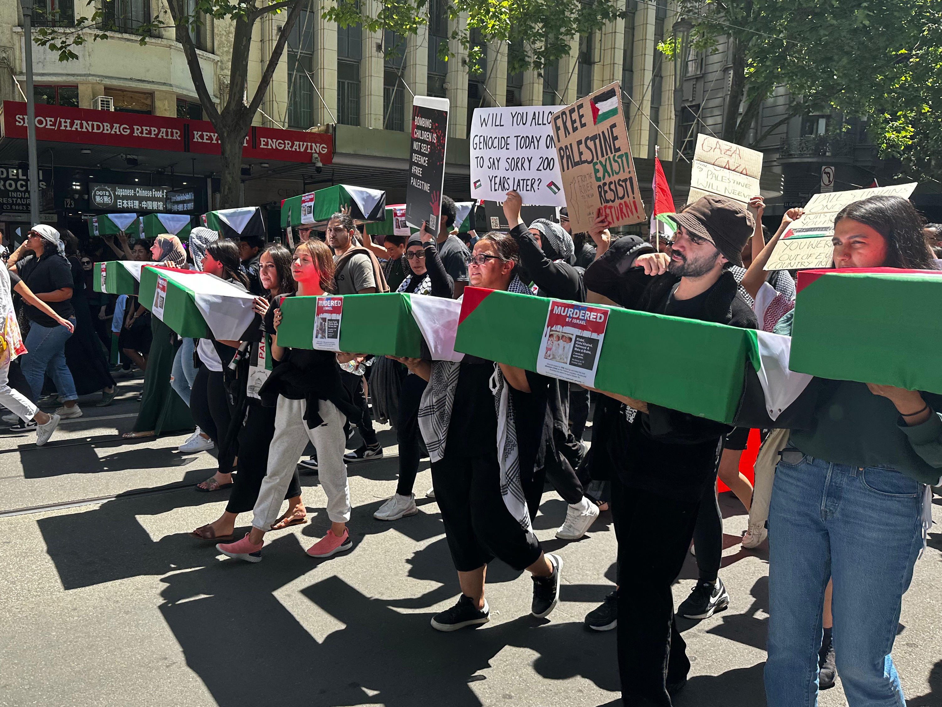 Pro-Palestinian demonstrators hold a rally to solidarity with the Palestinian people in Melbourne, Australia on November 5.