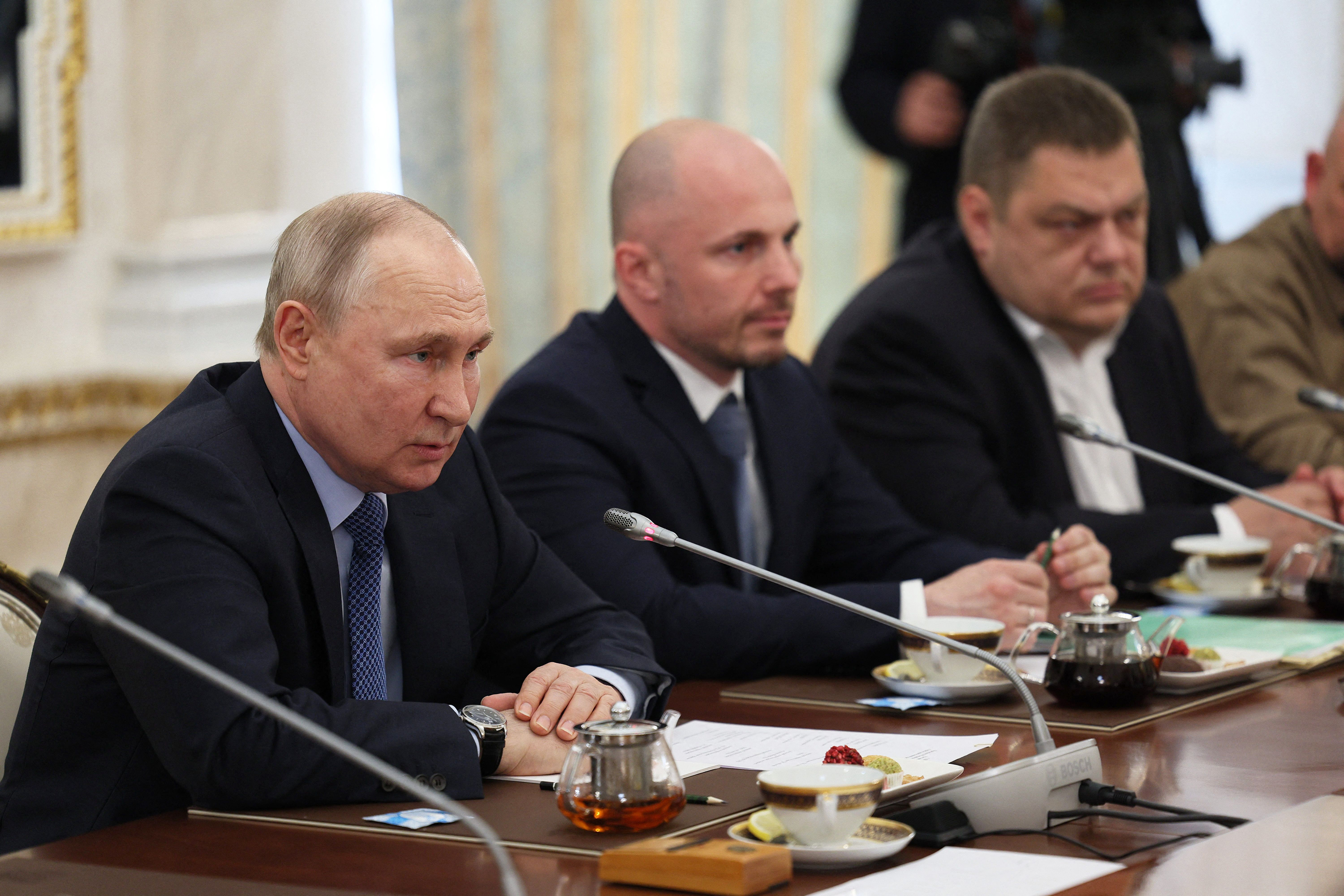 Russian President Vladimir Putin meets with war correspondents in Moscow on June 13.