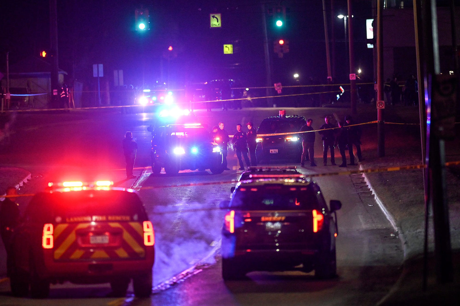 Police work the scene after midnight where a man suspected of a shooting on the Michigan State University campus died from a self-inflicted gunshot wound.