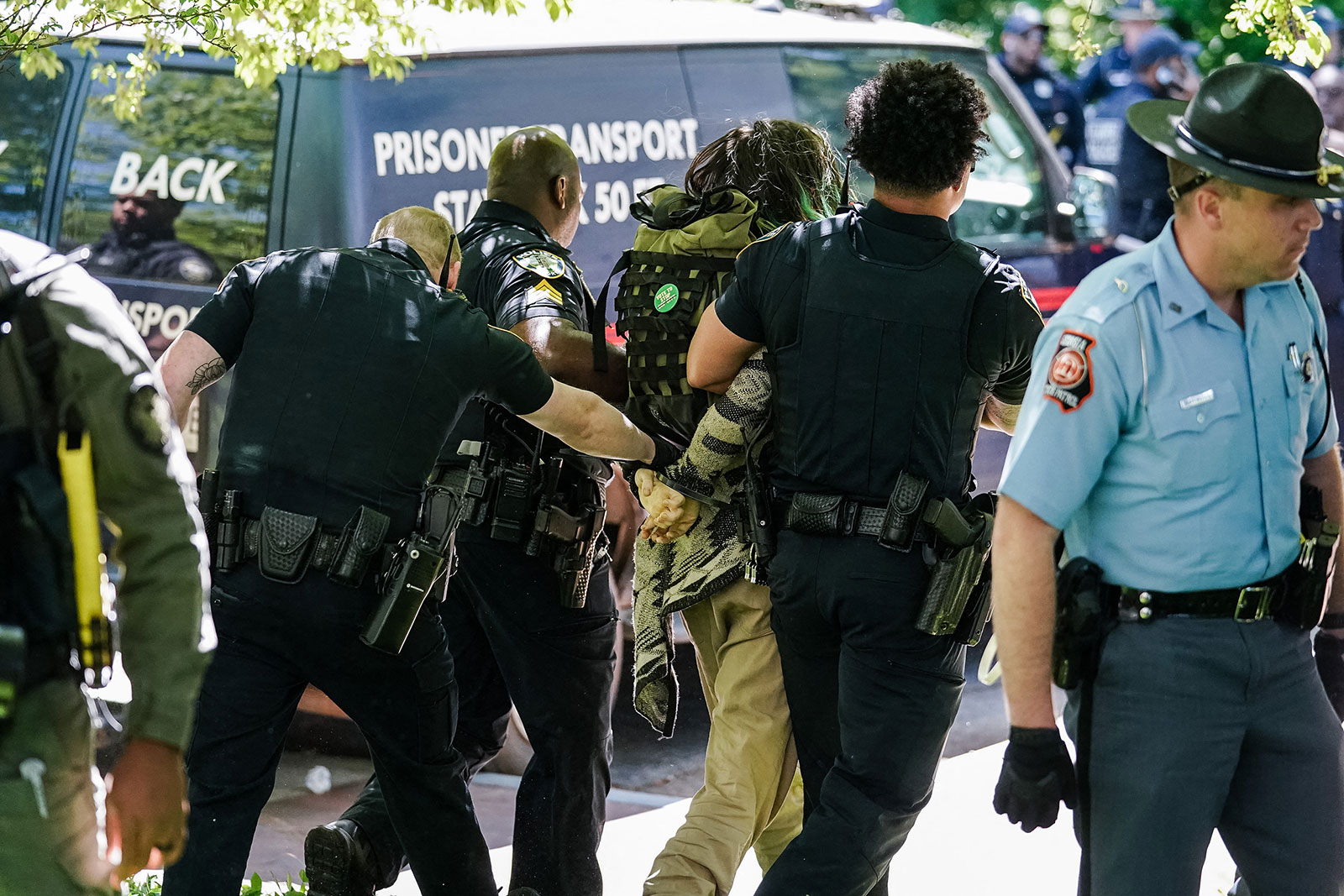 Police officers detain a demonstrator during a pro-Palestinian protest against the war in Gaza at Emory University on April 25, in Atlanta, Georgia. 