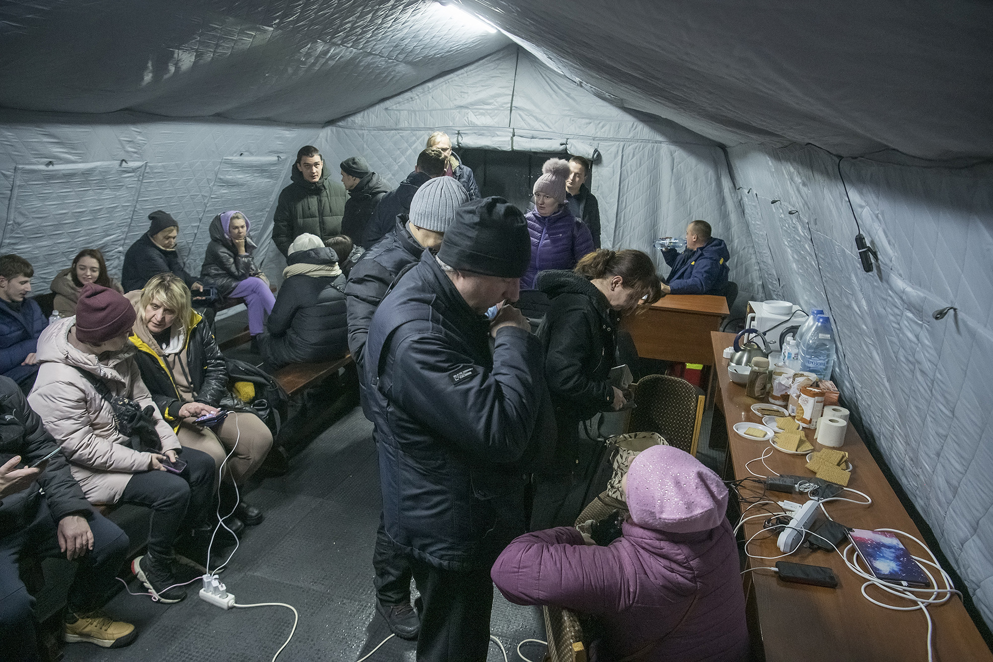 Local residents charge their devices, use internet connection and warm up inside Centre of Invincibility in Kyiv, Ukraine, on November 24.