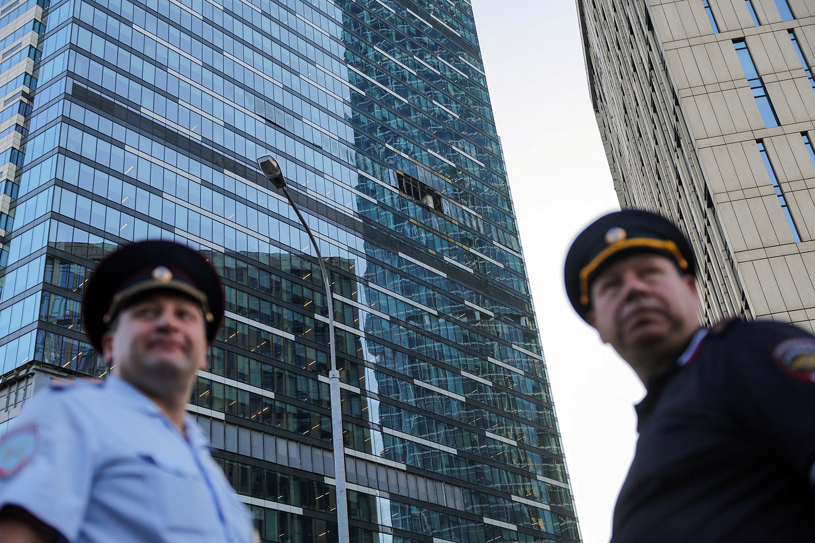 Emergency personnel work near a damaged office building following a reported Ukrainian drone attack in Moscow, Russia, on August 1.