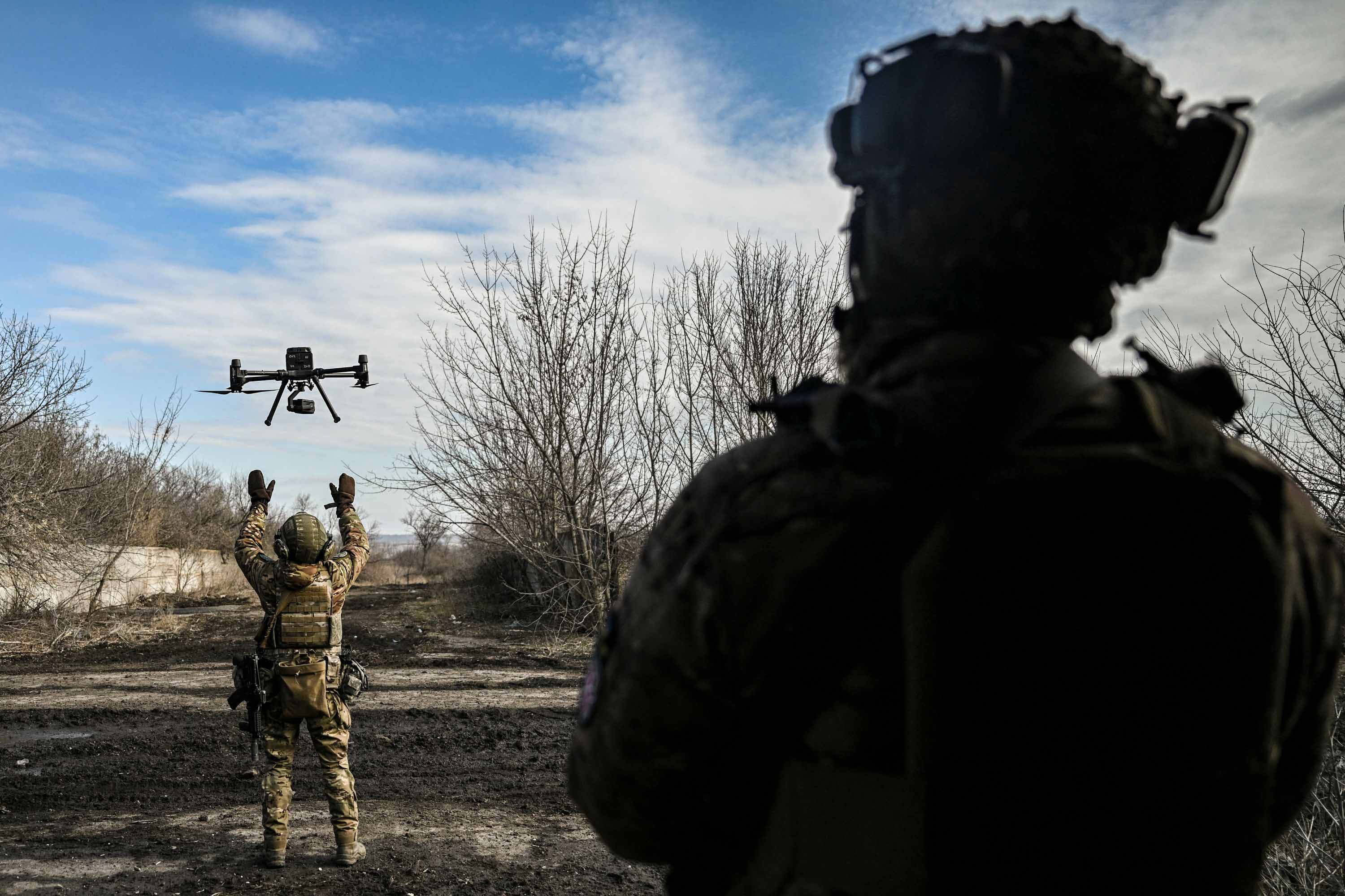 A Ukrainian serviceman flies a drone used to spot Russian positions near the city of Bakhmut, Ukraine, on Sunday, March . 