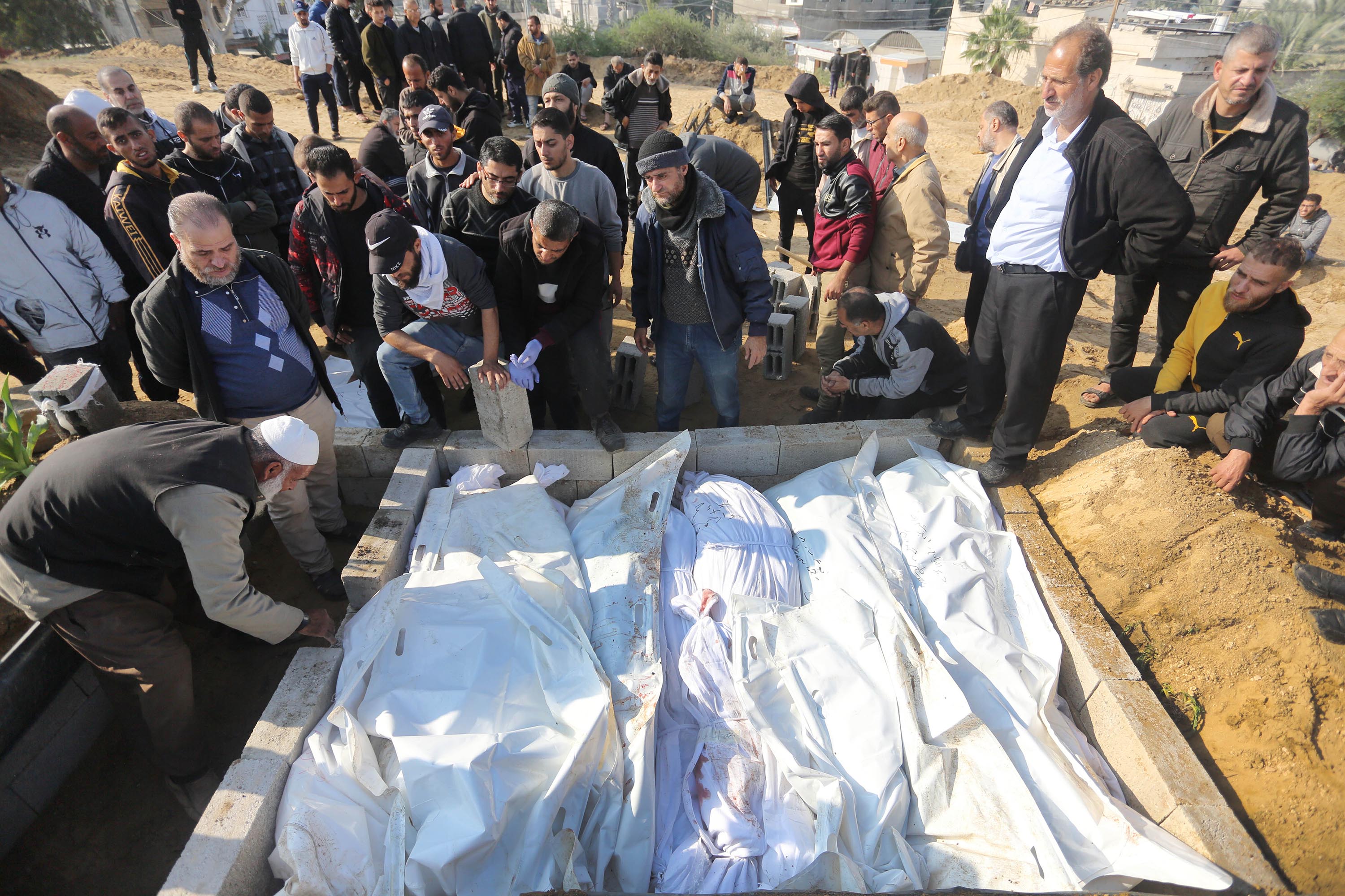 A funeral is held for members of a family killed during Israeli attacks in Deir al-Balah, Gaza, on January 2. 