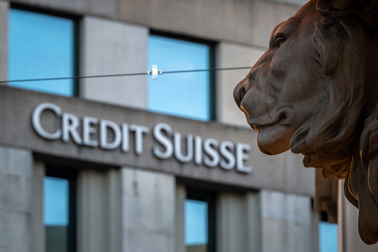 A sign of Credit Suisse bank is seen on a branch building in Geneva, on March 15.
